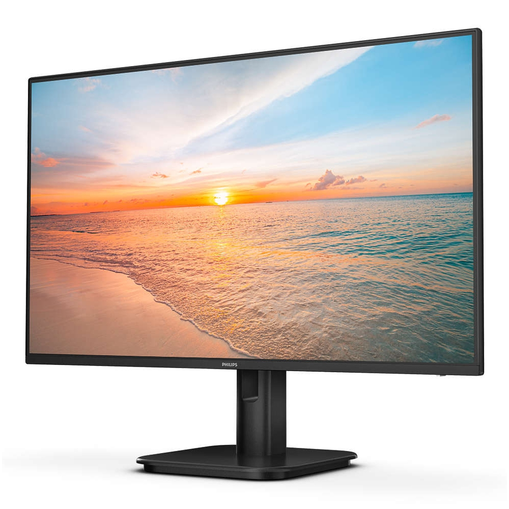 Monitor komputera wyświetlający zachód słońca nad oceanem z logo Philips.