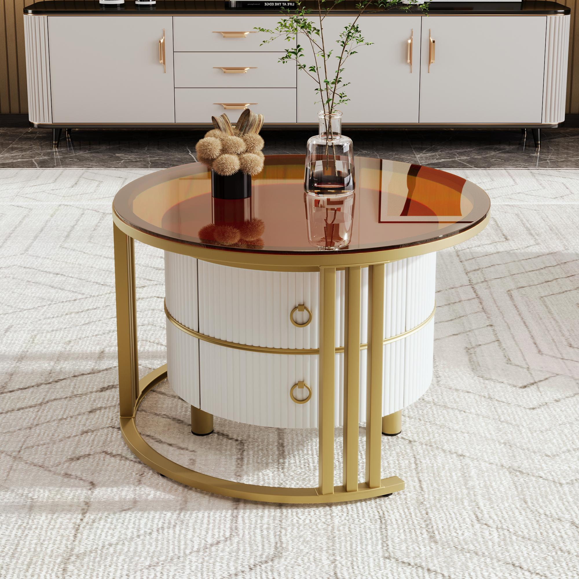 Runder Couchtisch mit Glasplatte und weißen Schubladen, goldene Akzente.