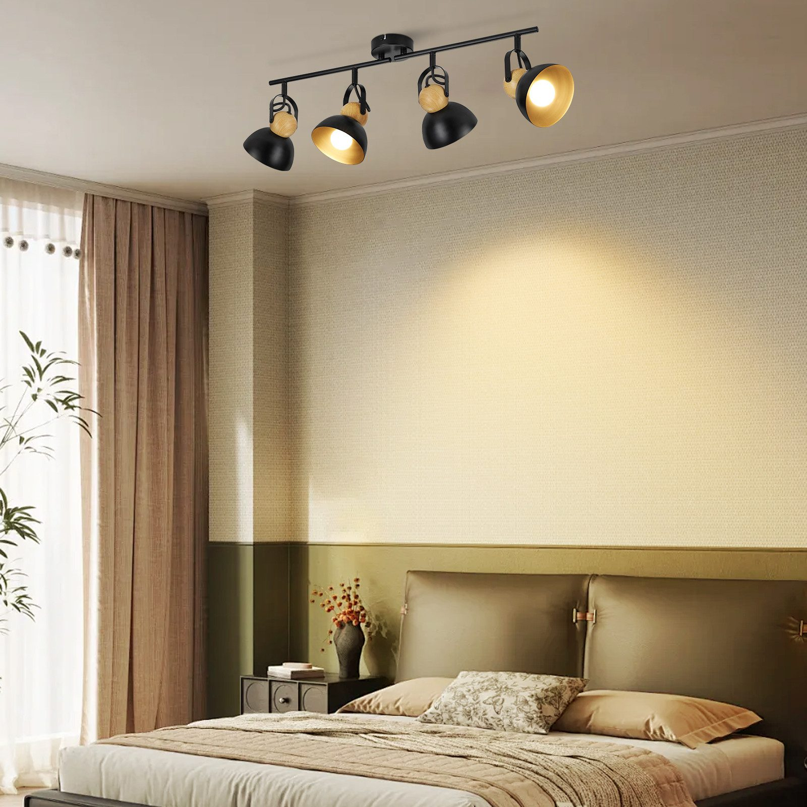 Sypialnia z łóżkiem, czarnymi reflektorami sufitowymi i neutralną paletą barw.