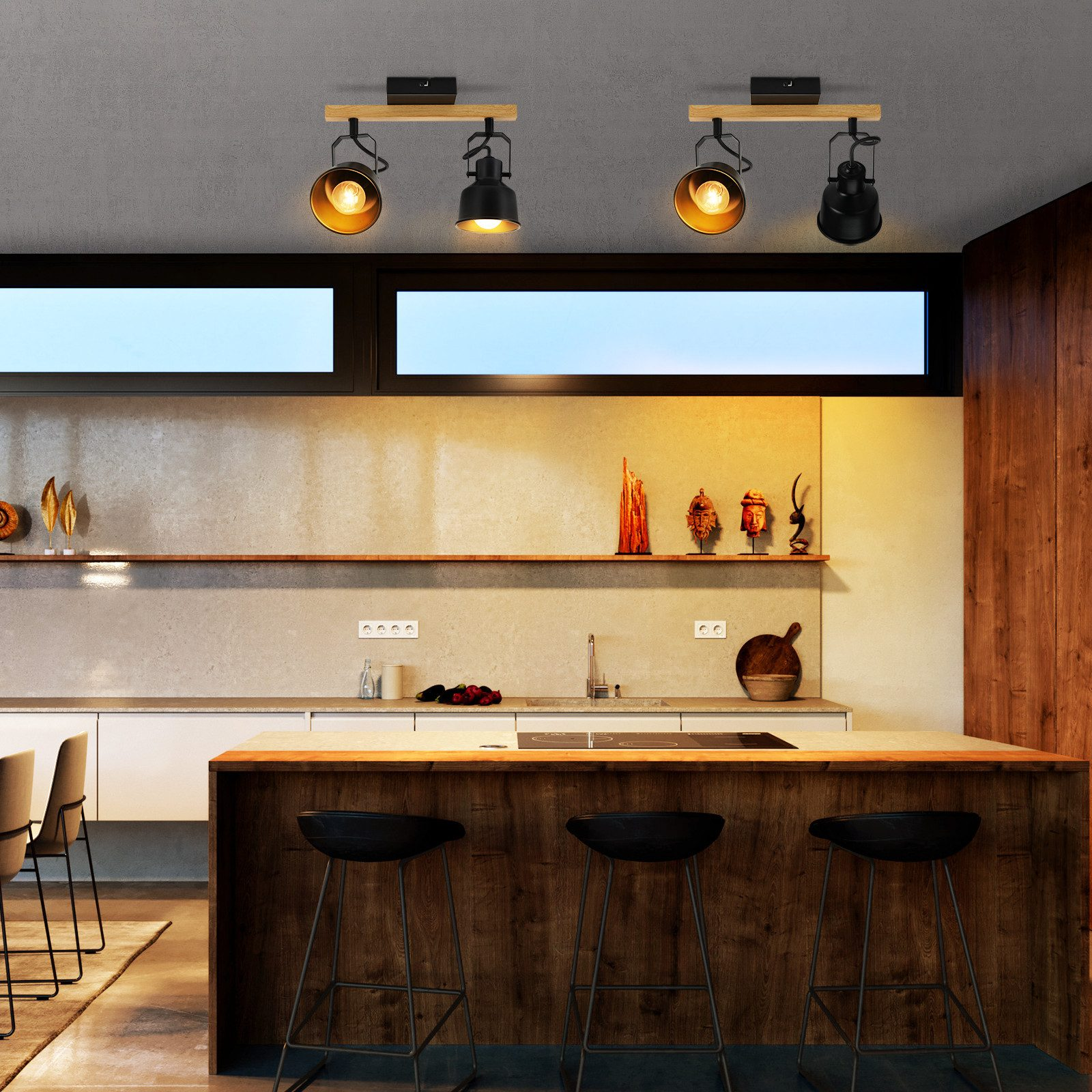 Kuchnia z reflektorami na drewnianych belkach, trzema czarnymi stołkami i drewnianą wyspą.