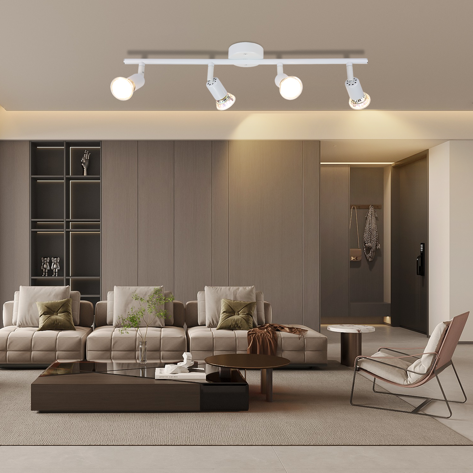 Ujęcie wnętrza nowoczesnego salonu z oświetleniem szynowym, sofą, stolikiem kawowym i elementami dekoracyjnymi.