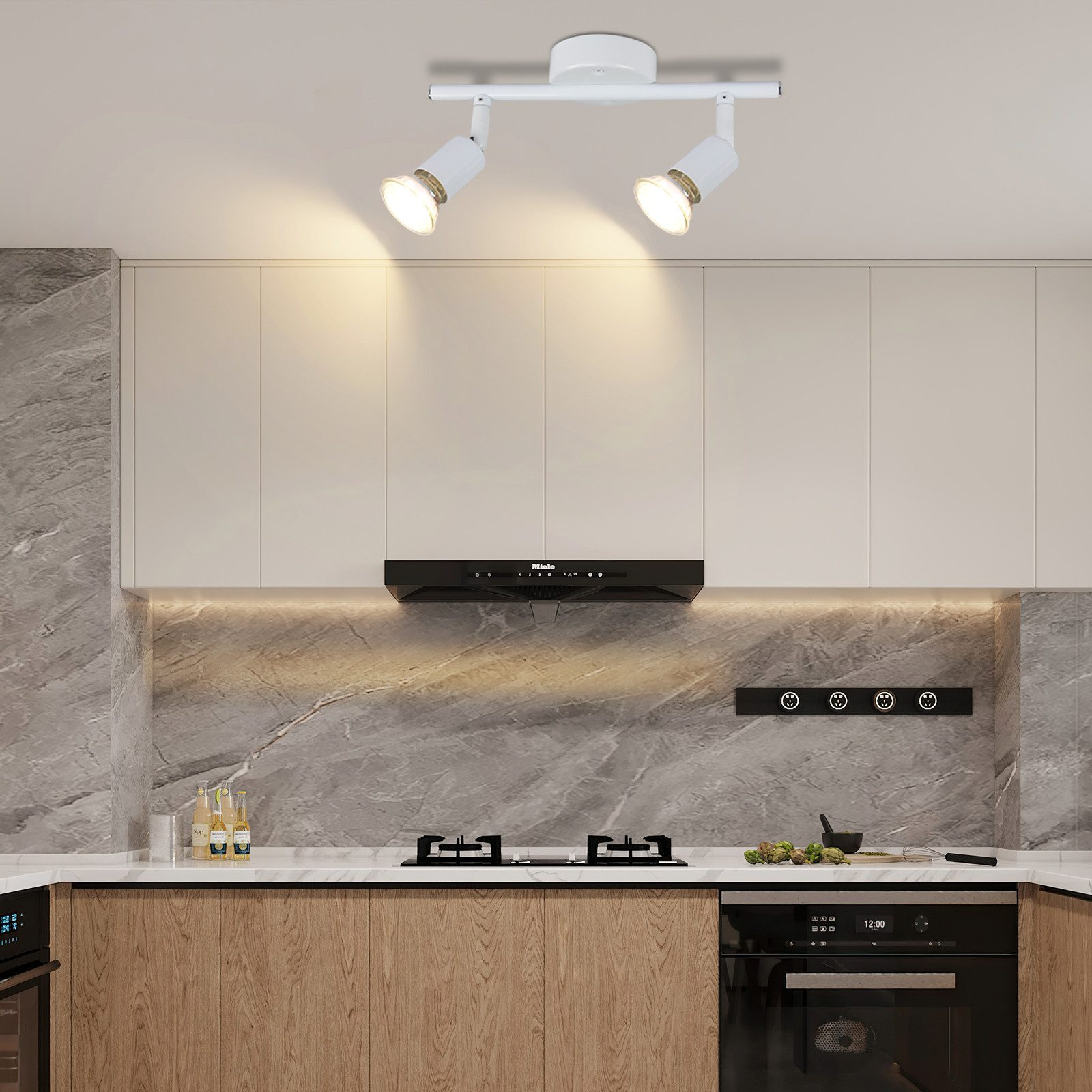 Biała lampa sufitowa z dwoma reflektorami w kuchni. Kuchnia ma białe szafki i czarny okap.