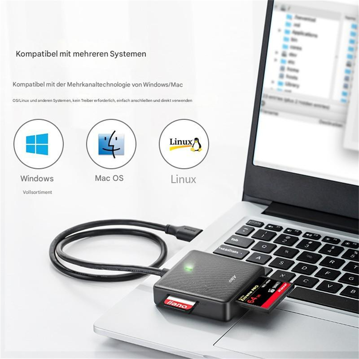 Laptop mit mehreren Betriebssystemlogos und Kartenleser mit Karte.