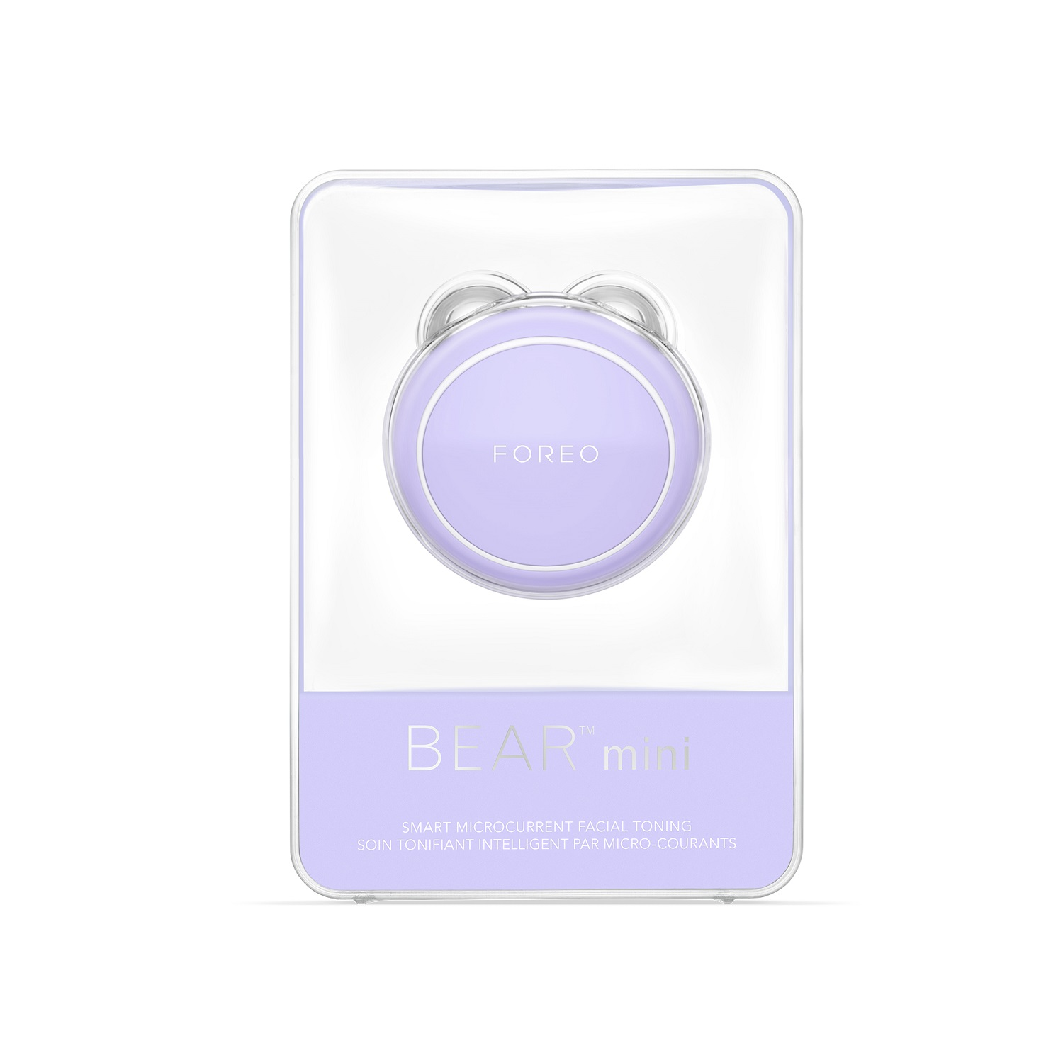 Dispositivo di tonificazione facciale Foreo Bear Mini in custodia di plastica trasparente. Colore lavanda, sfondo bianco.