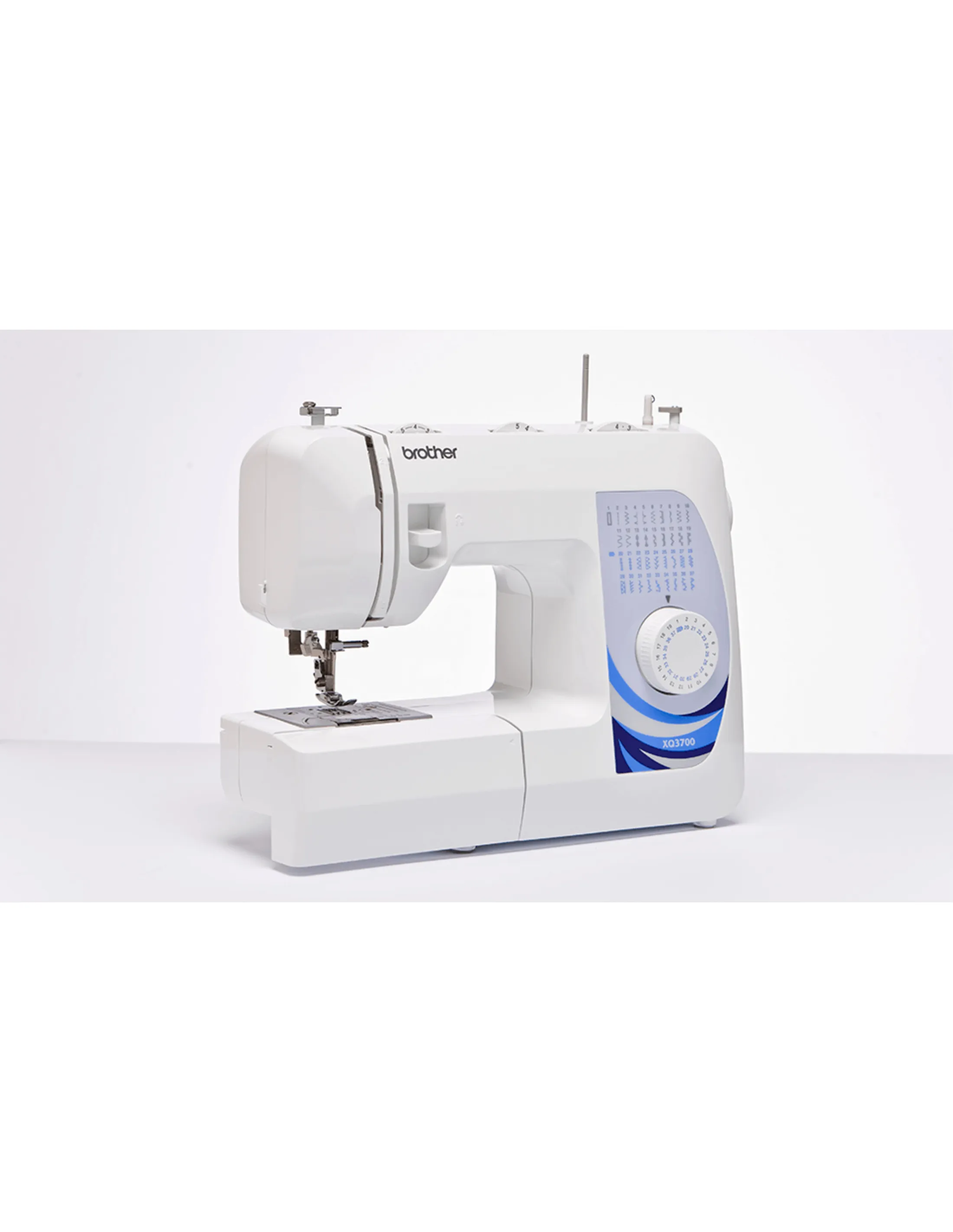 White Brother sewing machine with blue and white design. White background. Brand name 