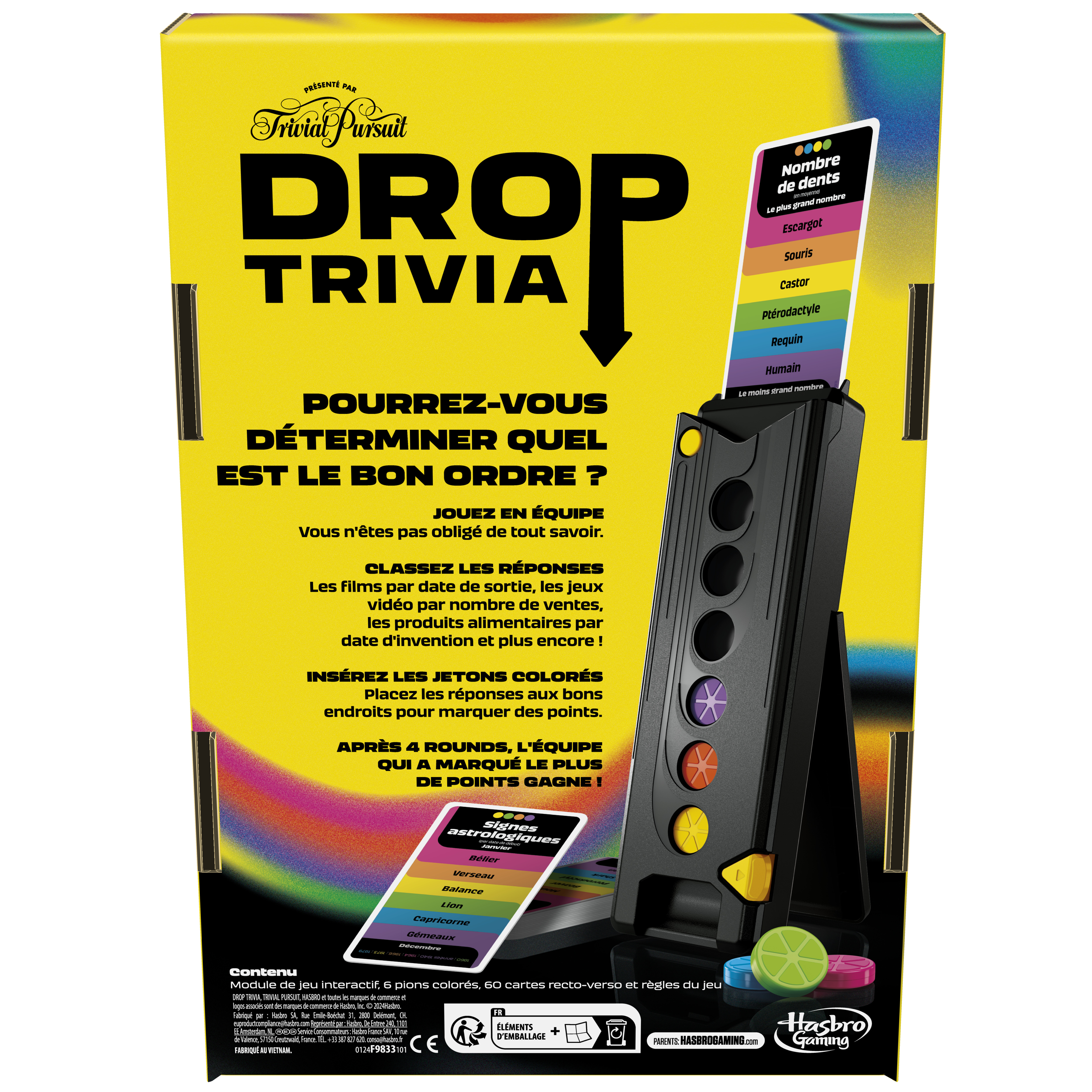 Drop Trivia Spielbox und Aufbau. Ein schwarzer Ständer mit farbigen Löchern und Karten. Bunte Spielsteine liegen unten.