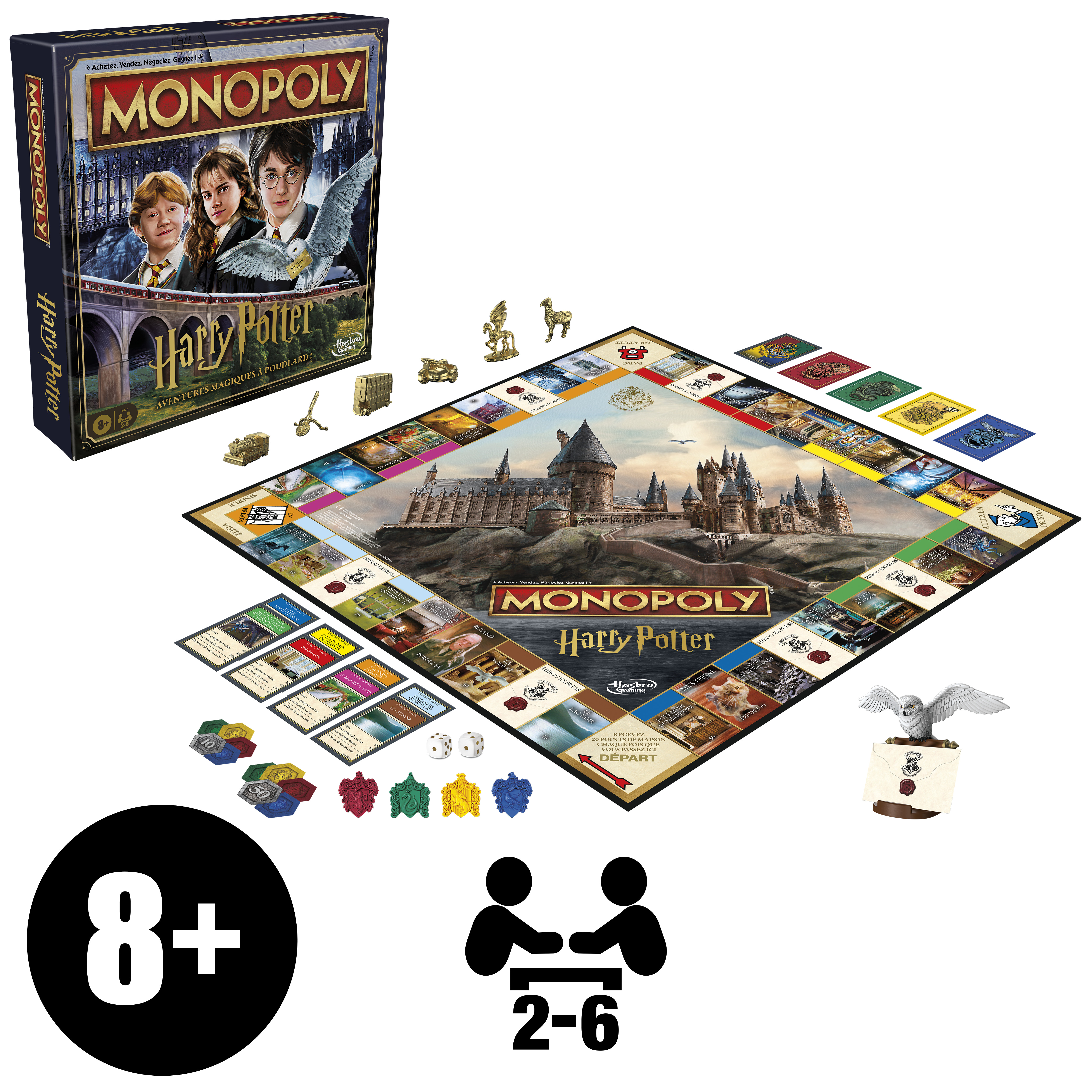 Gra Monopoly Harry Potter. Widoczna plansza, pudełko, pionki, karty, kostki do gry i figurka.