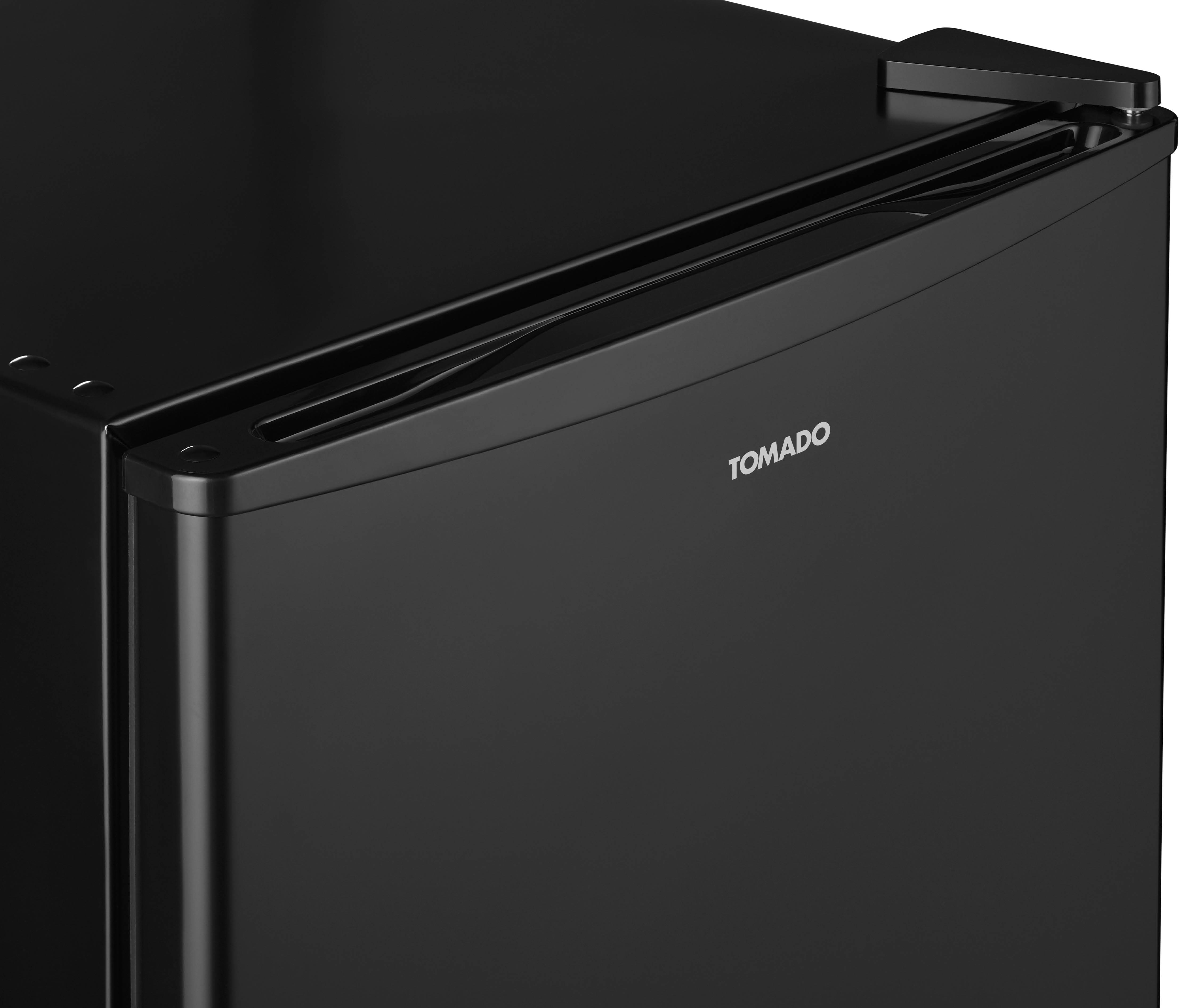 Close-up of a black refrigerator door with the Tomado logo.