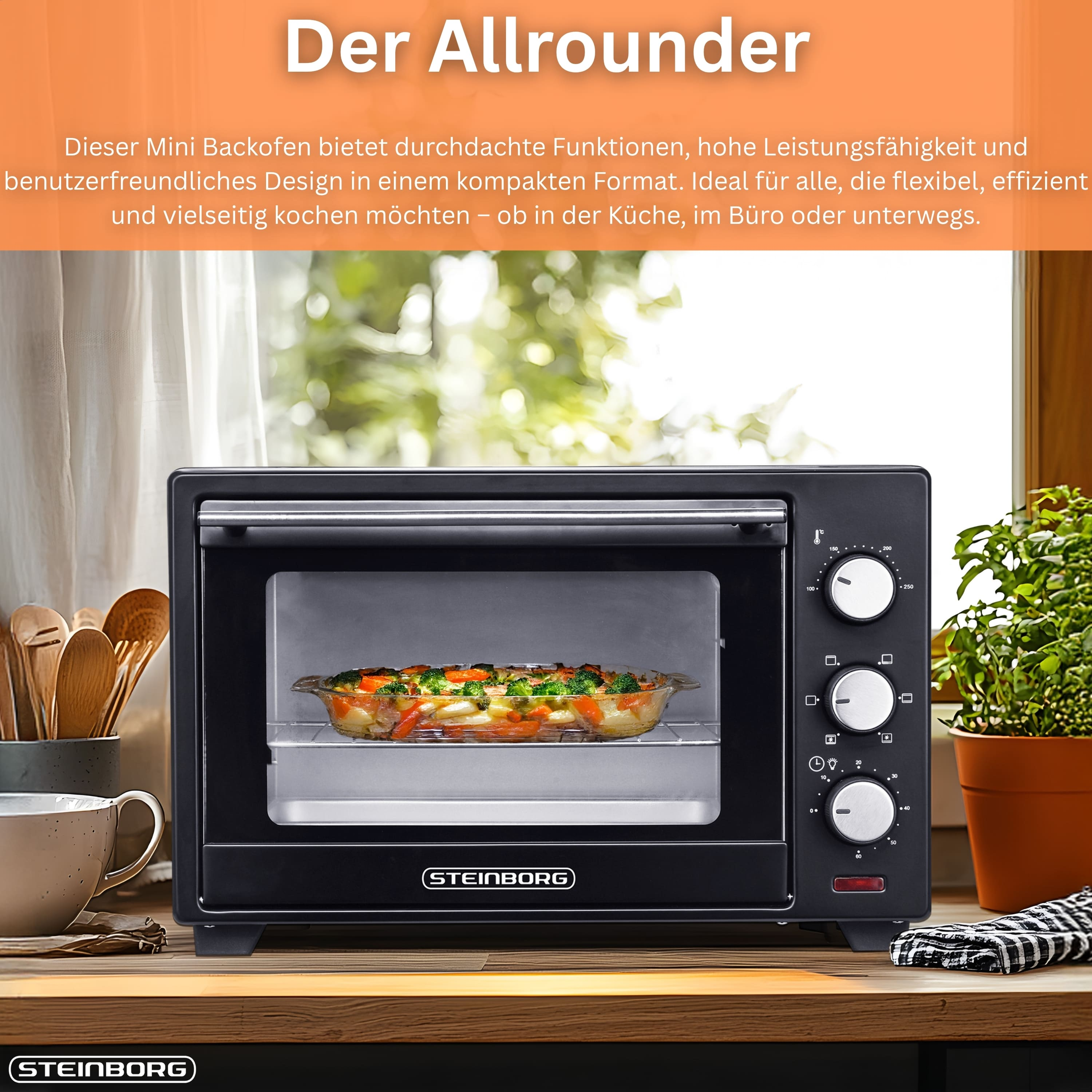 Schwarzer Mini-Backofen mit Essen. Es hat Timer- und Temperaturregler. Der Ofen steht auf einem Holztisch.