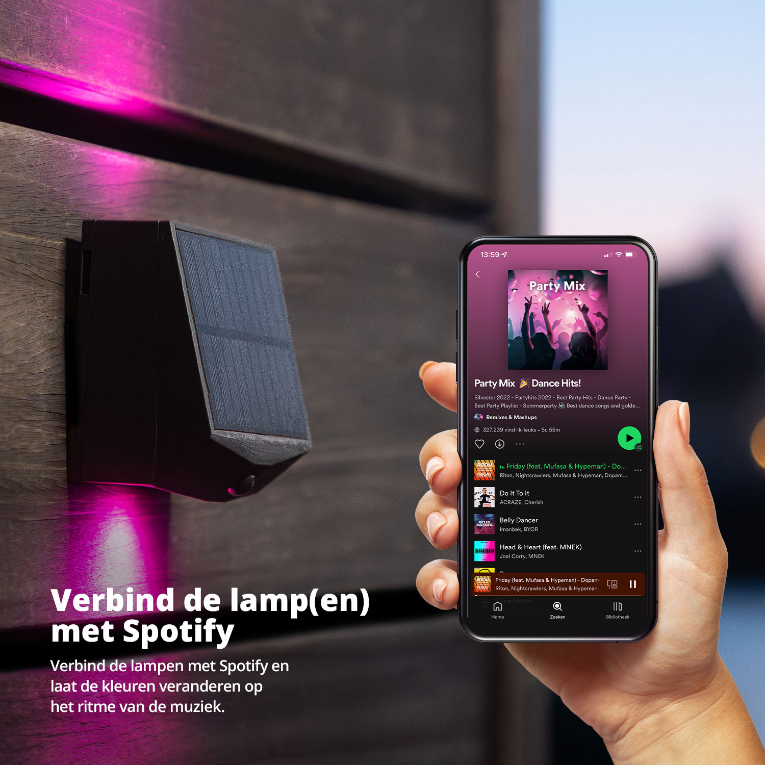 A hand holding a phone showing music app controls, next to a wall-mounted light.