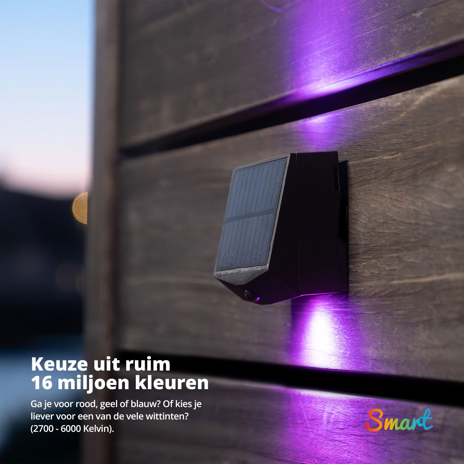 A black solar-powered light with purple light on a wooden wall.