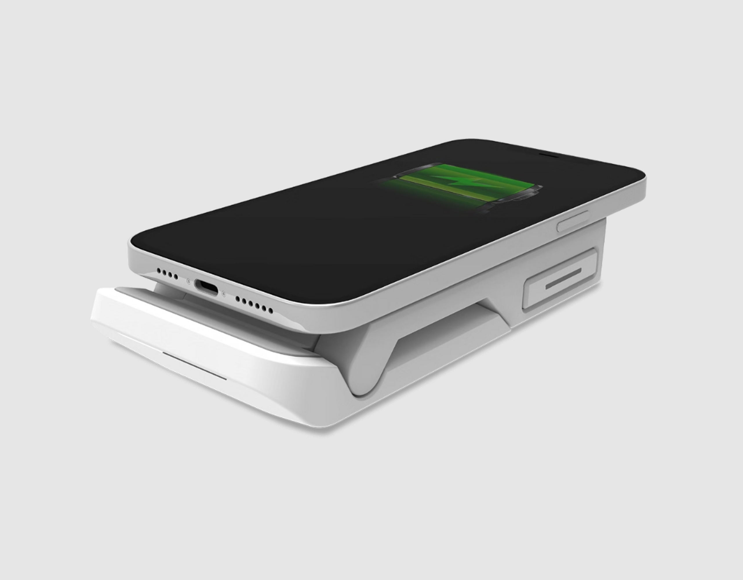 Cargador inalámbrico blanco con un teléfono negro, mostrando un icono de batería cargando.