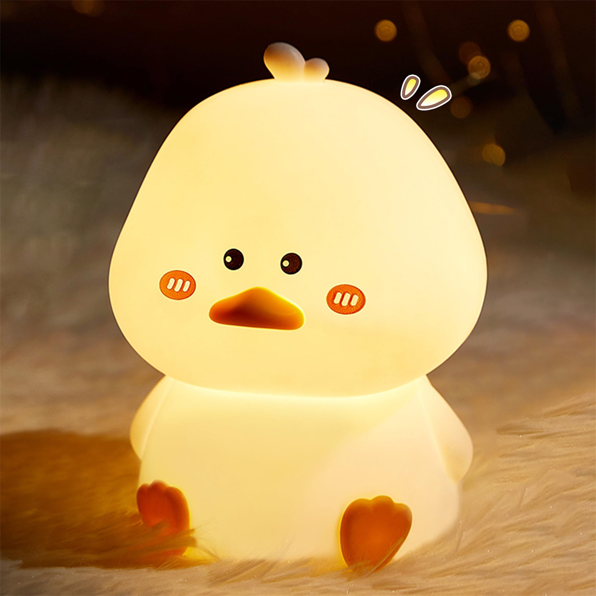 Ein leuchtendes, weißes Enten-Nachtlicht mit sanftem, warmem Licht auf einer pelzigen Oberfläche.