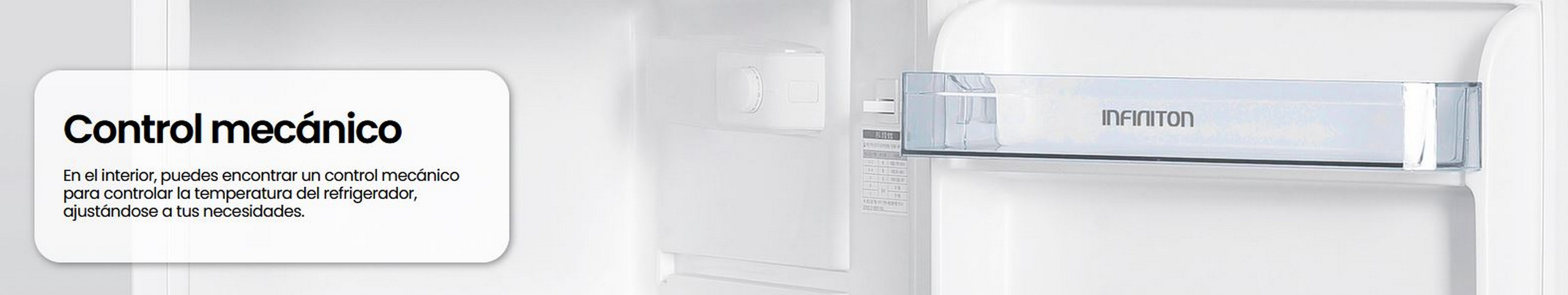 Interior del frigorífico, con estante y cajón. Hay un control mecánico de la temperatura.