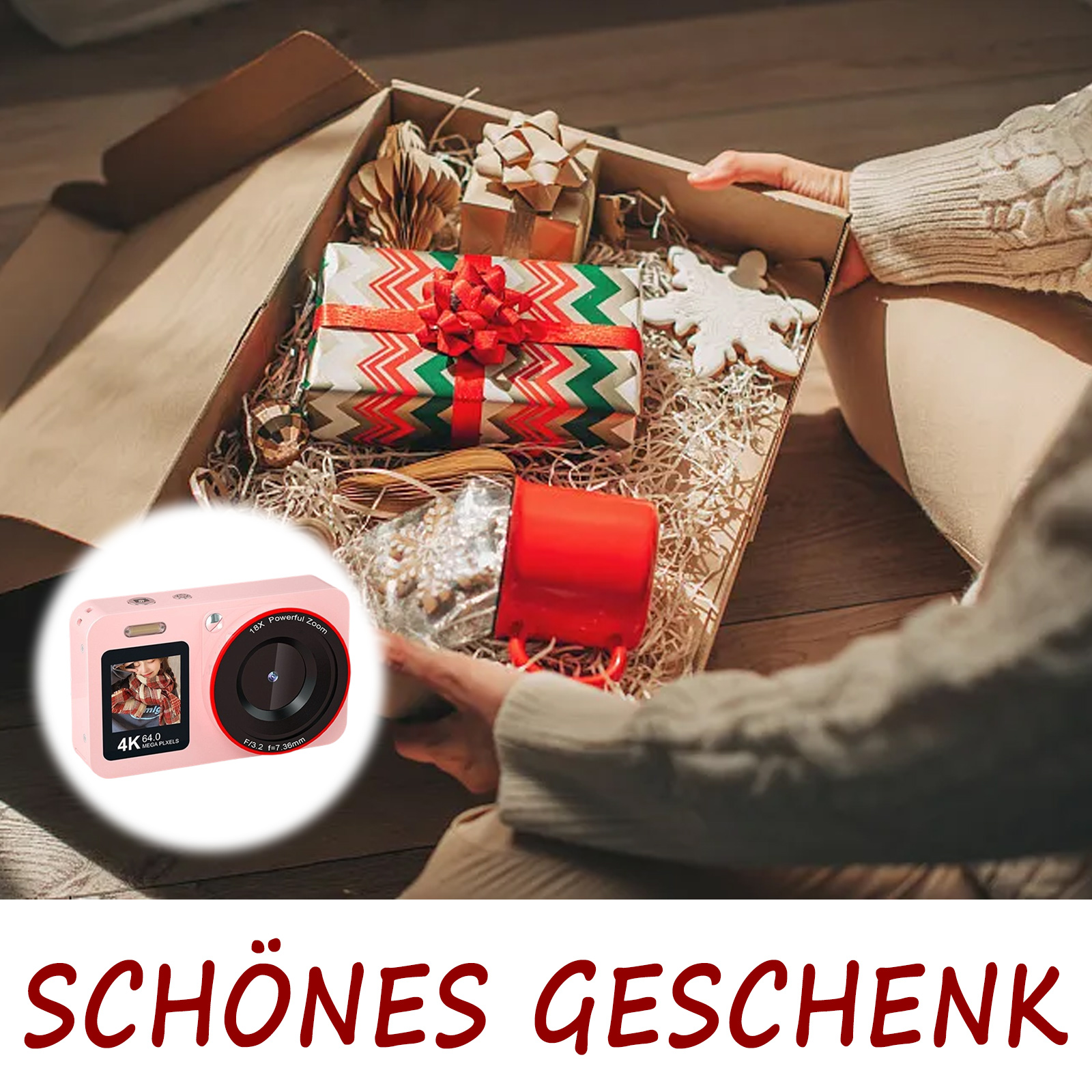 Pinke Kamera in Geschenkbox mit anderen Geschenken und Dekorationen.