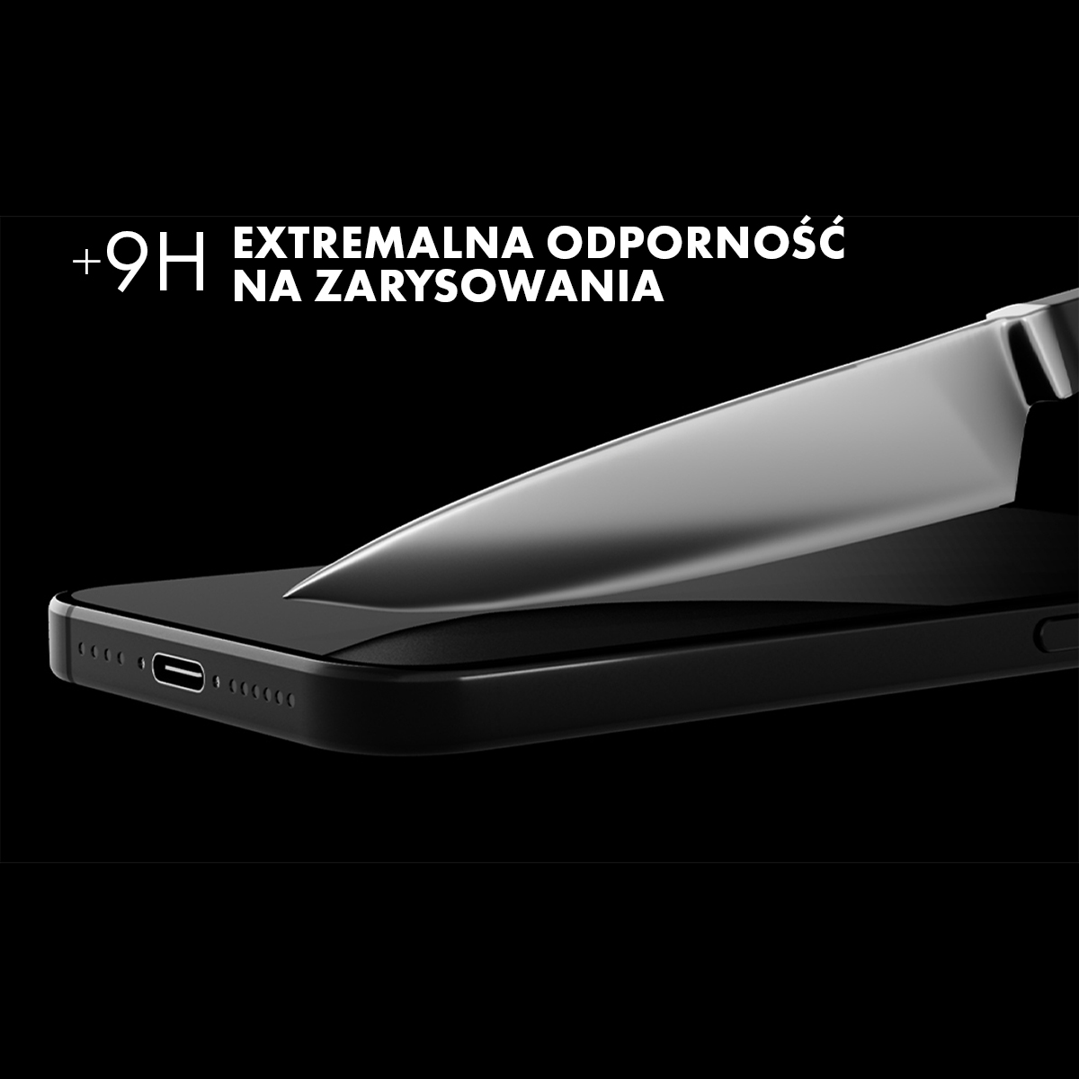 Nóż przecina czarny smartfon z tekstem o odporności na zarysowania.