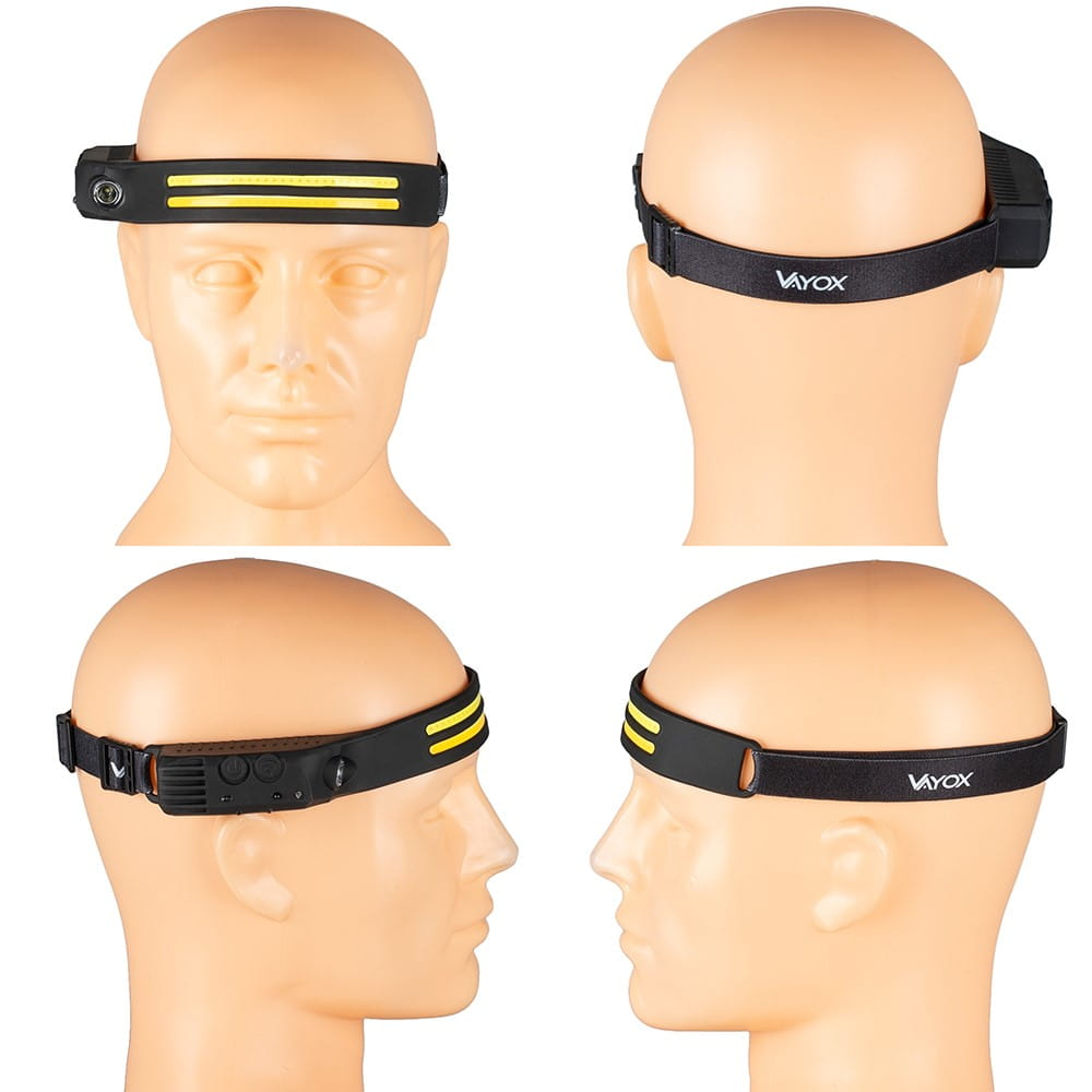 Latarka czołowa na głowie manekina. Czarna z żółtymi paskami i czarnym paskiem.