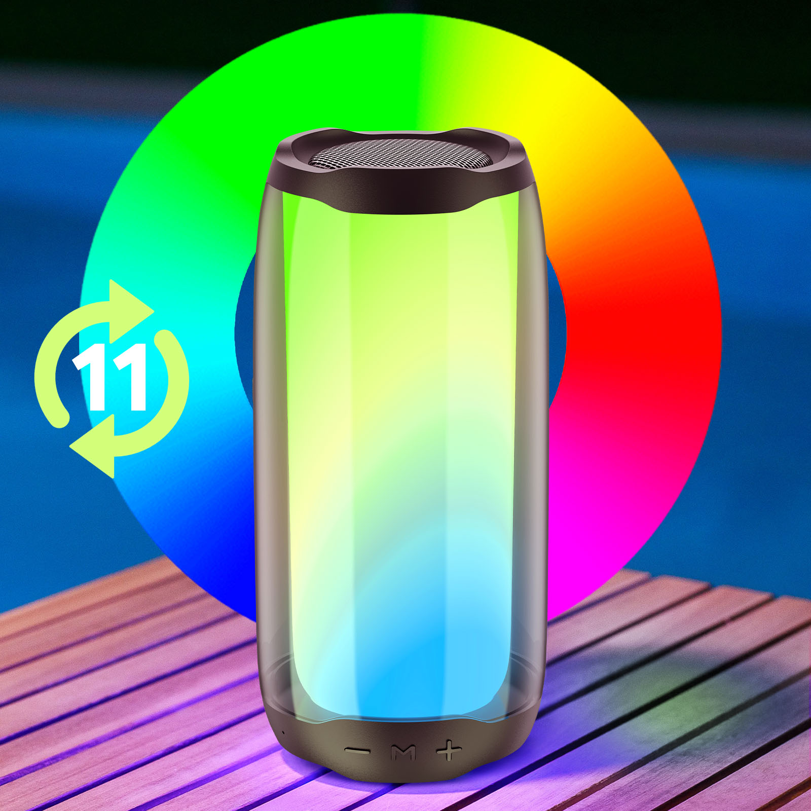 Un haut-parleur cylindrique avec un affichage lumineux coloré, sur une surface en bois avec un fond arc-en-ciel.