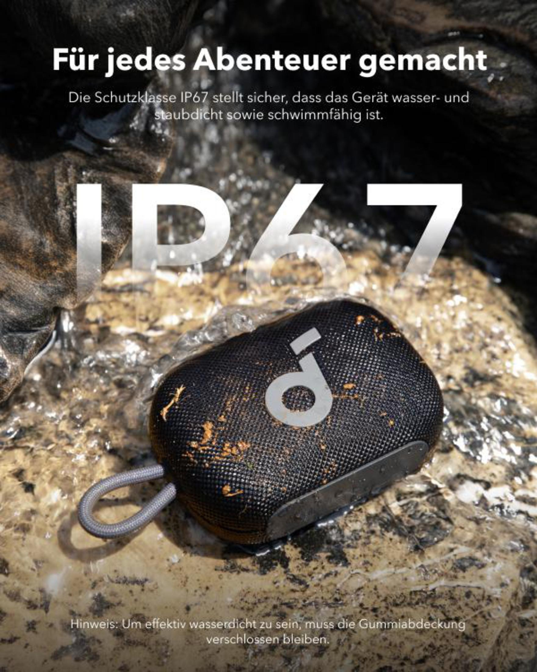Schwarzer Lautsprecher auf Felsen, mit IP67-Text. Lautsprecher hat Griff.