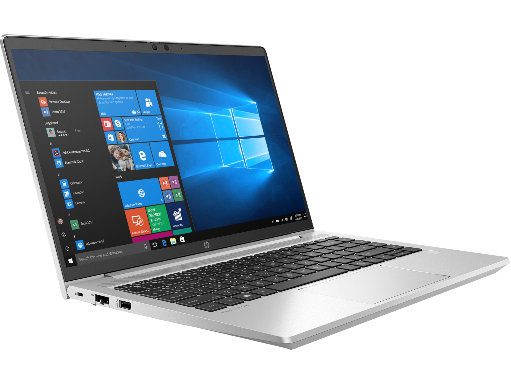 A silver laptop with a black keyboard, open on a white surface.