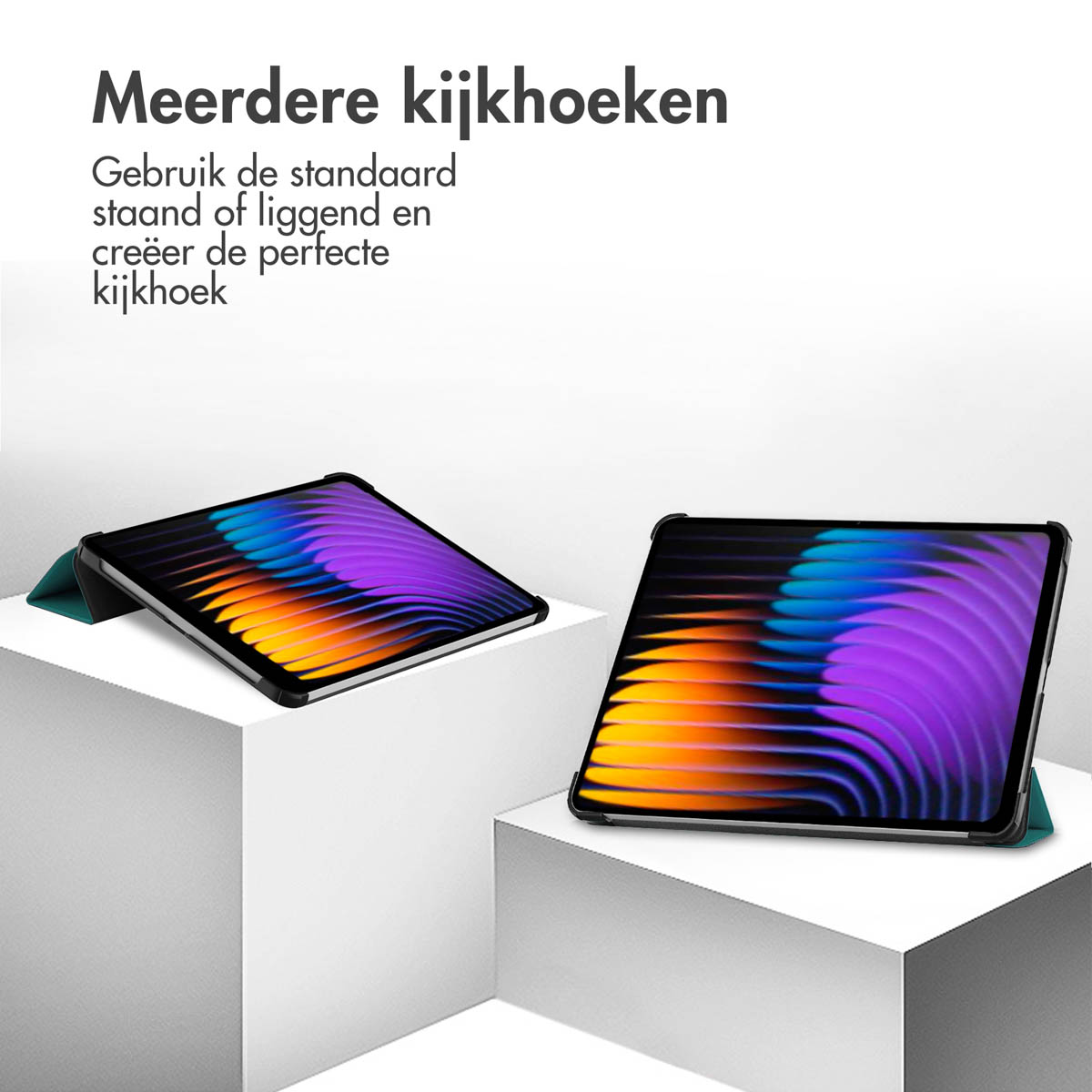 Two tablets on white blocks. The screens show colorful graphics. The cases are open.