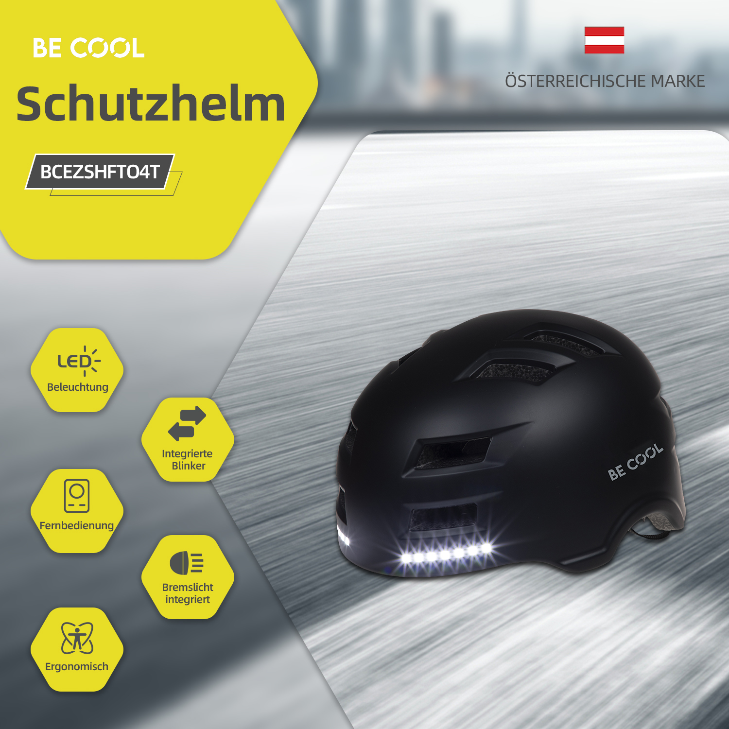 Schwarzer Fahrradhelm mit weißen Lichtern, gelbem Text und österreichischer Flagge.