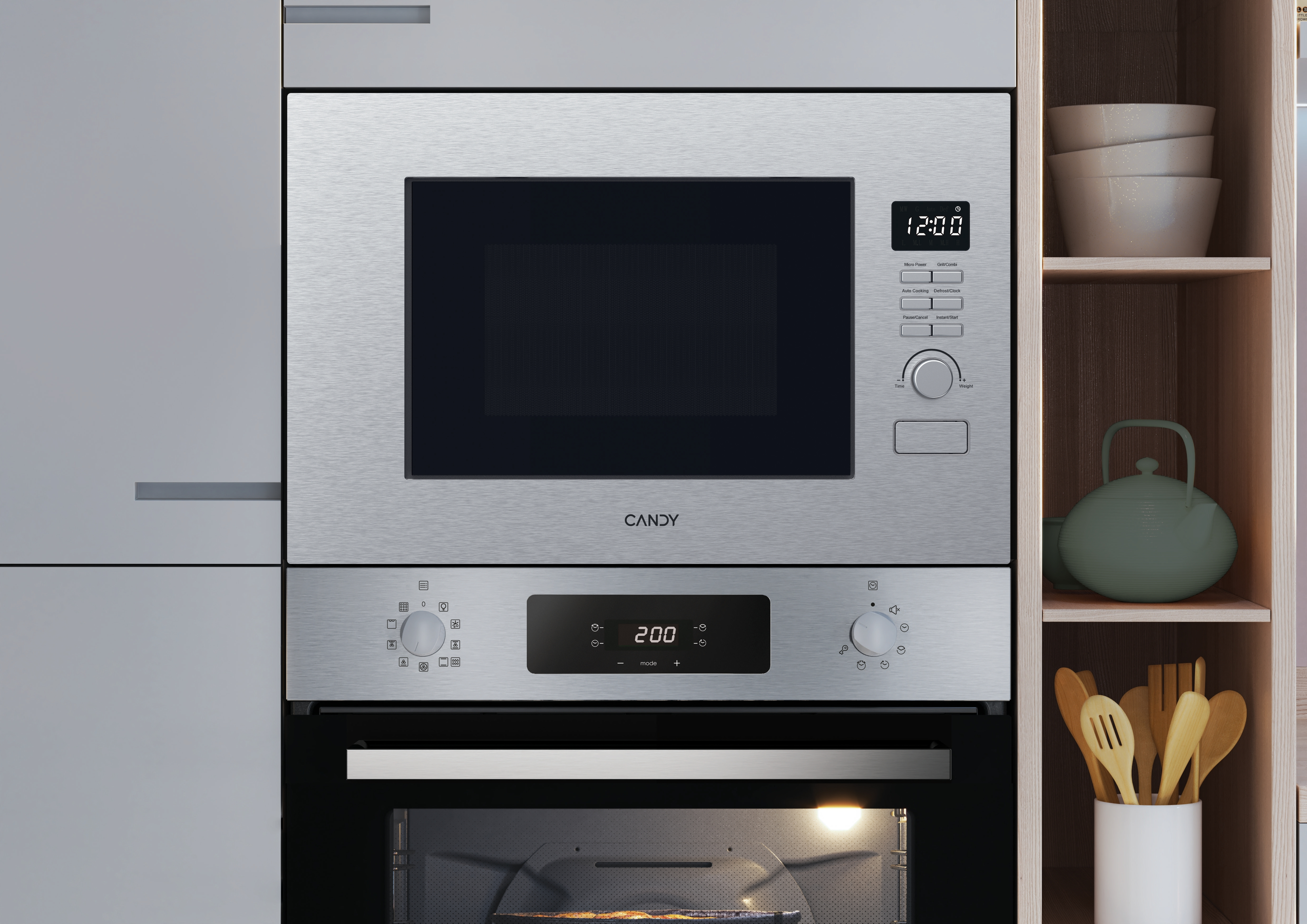 Microondas y horno empotrados combinados. La pantalla digital muestra las 12:00. Marca Candy. Entorno de cocina.
