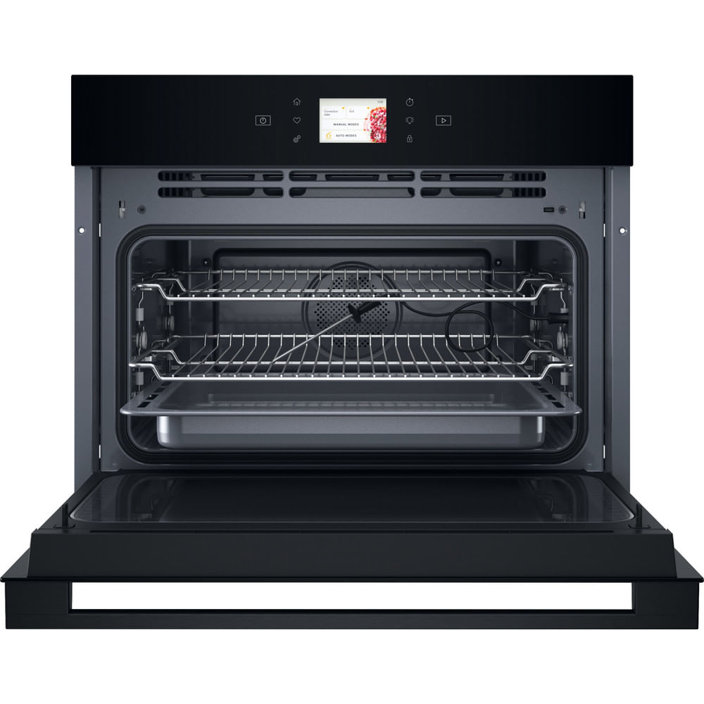 Black oven with the door open, revealing racks and baking tray inside. The interior is visible.