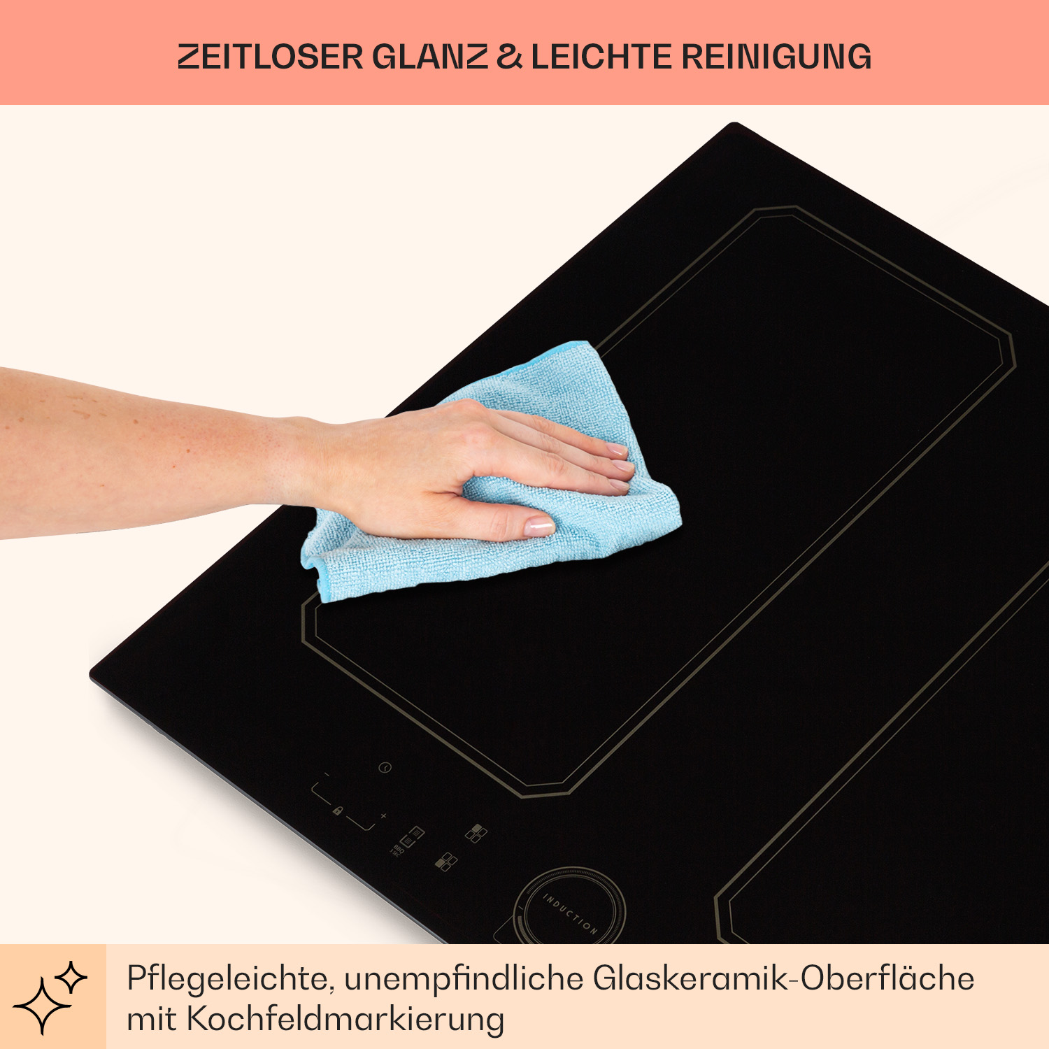 Eine Person reinigt ein schwarzes Induktionskochfeld mit einem blauen Tuch, Nahaufnahme.
