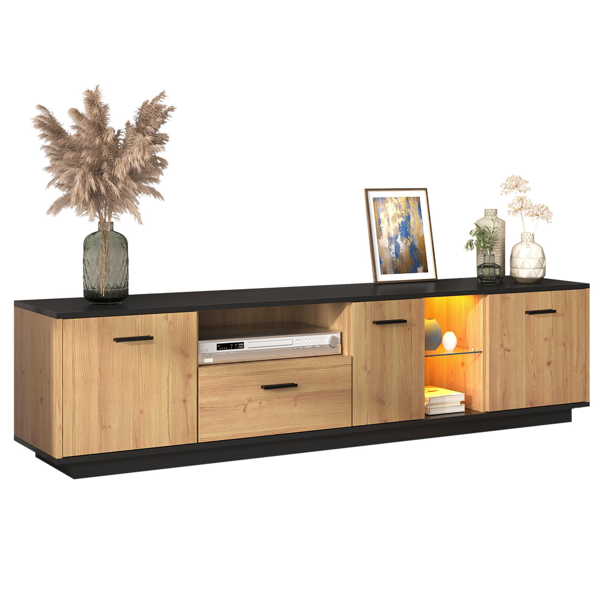 Ein TV-Ständer aus Holz mit schwarzen Akzenten. Dekoriert mit Blumen und einem Bilderrahmen.