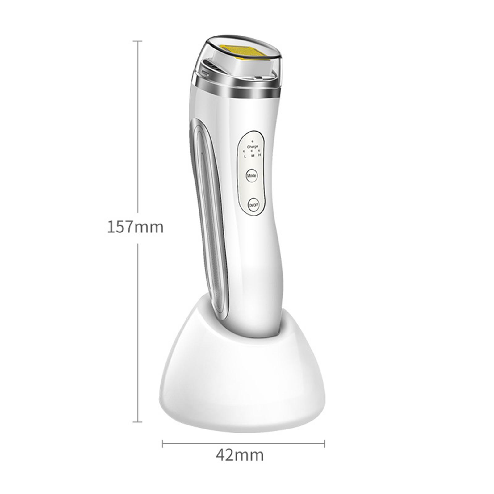 Ein weißes medizinisches Gerät auf seinem Ladeständer, mit den Abmessungen: 157 mm Höhe und 42 mm Breite.