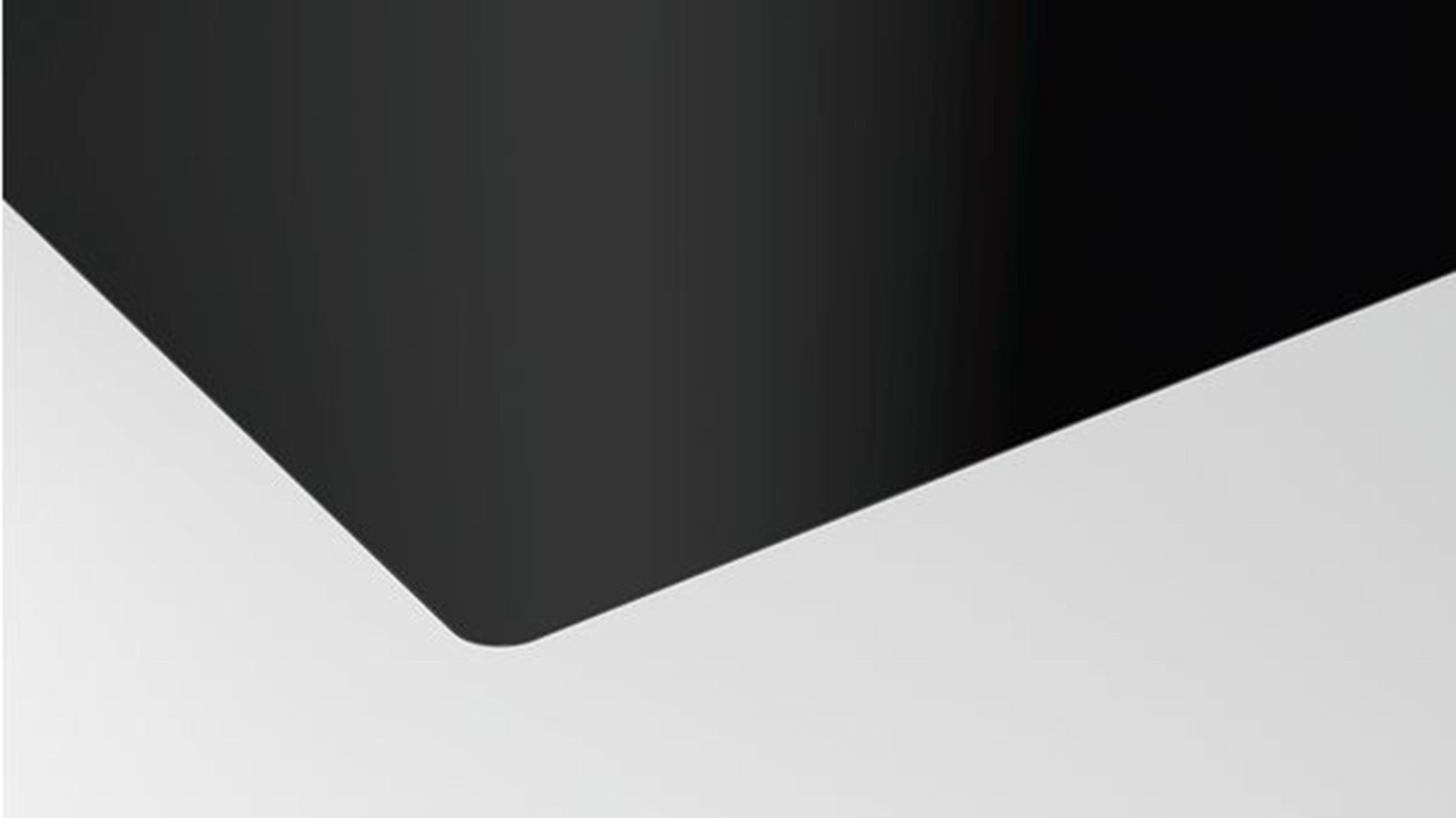 Ein schwarzes Quadrat mit abgerundeter Ecke vor weißem Hintergrund.