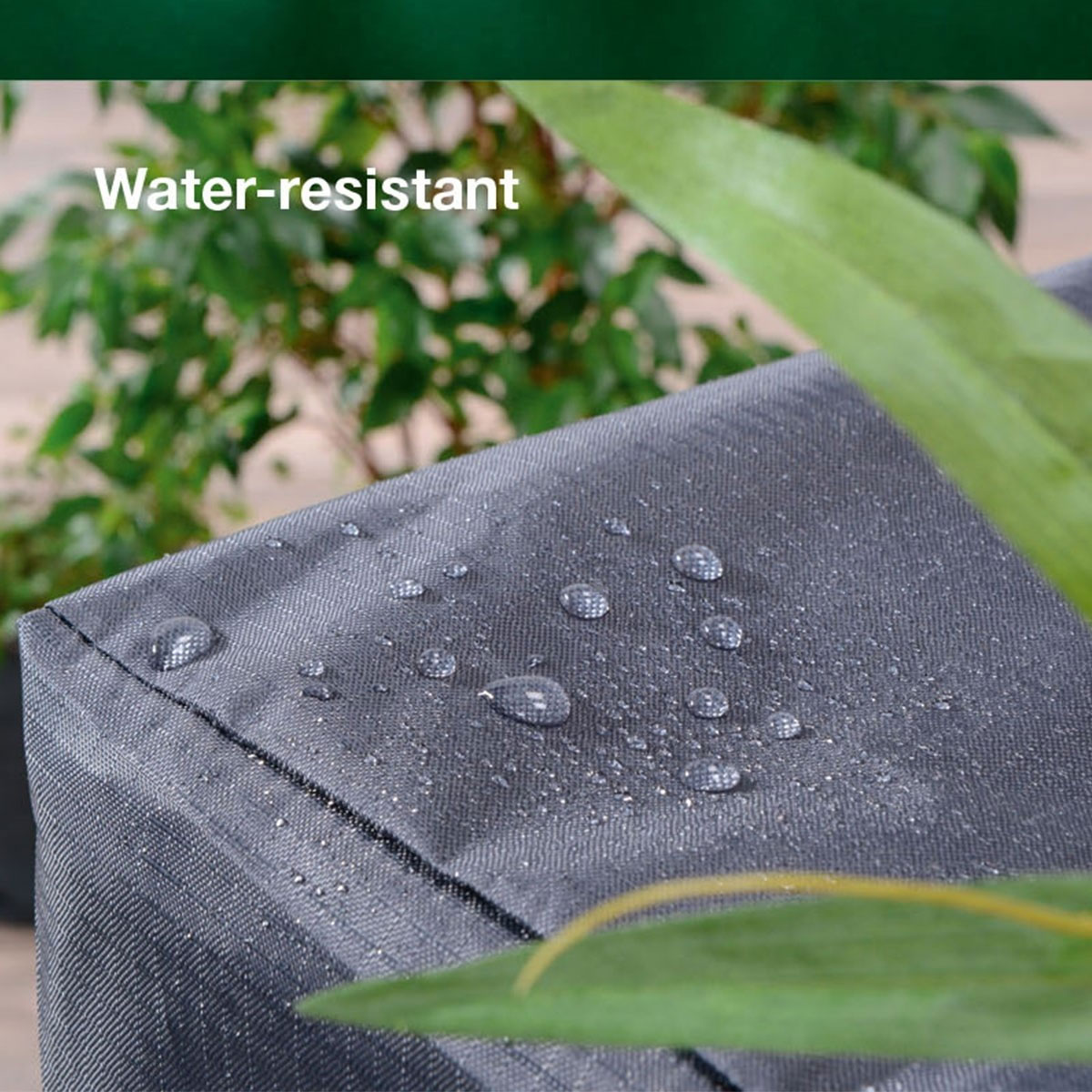 Close-up of water droplets on a dark gray fabric. The text 'Water-resistant' is visible.
