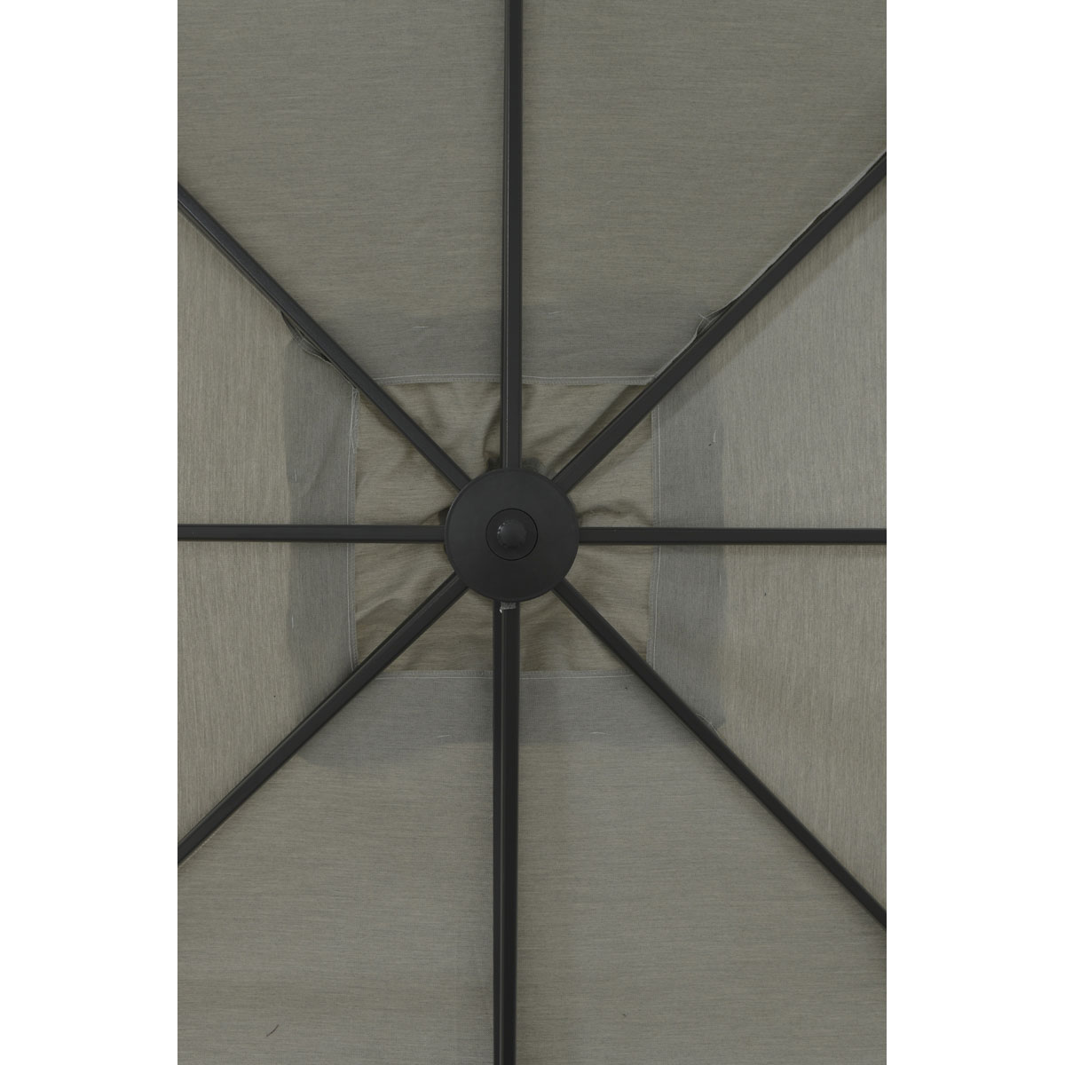 Close-up view of an open gray umbrella's top. Shows fabric and support structure.