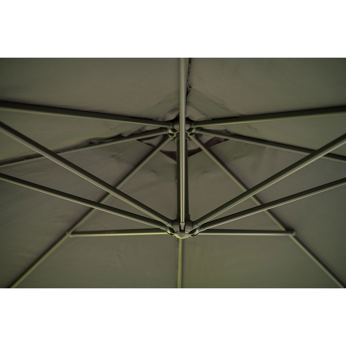 View from underneath of a gray umbrella structure. Dark gray fabric and metal.
