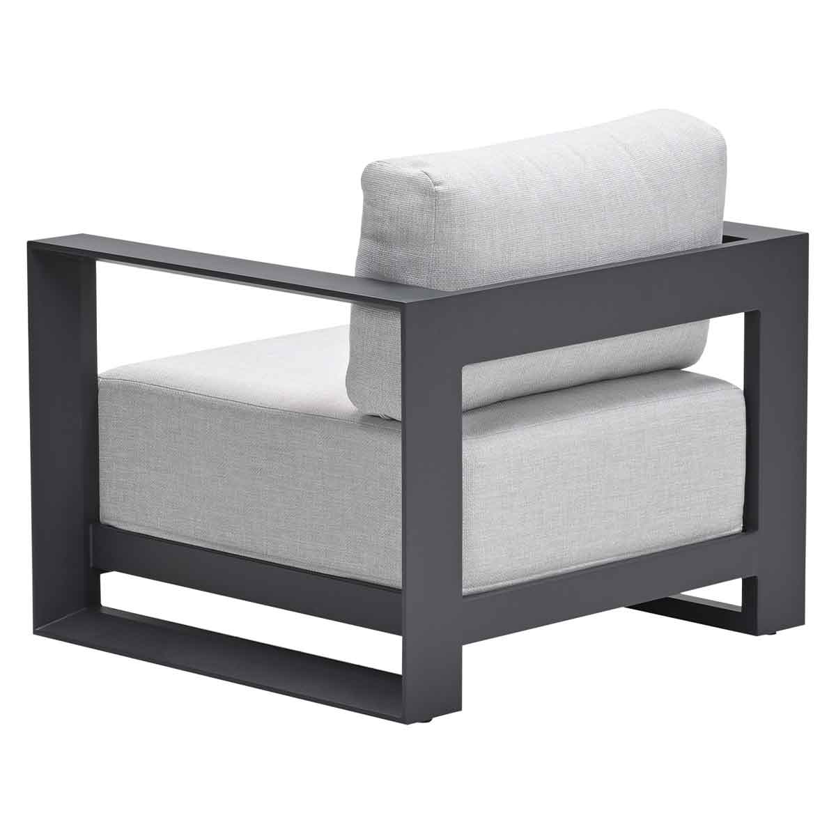Modern gray armchair, back view. Gray cushion and black frame.
