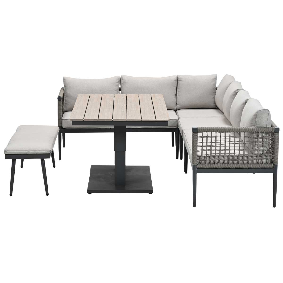 Ensemble canapé gris en L avec table et banc sur fond blanc.