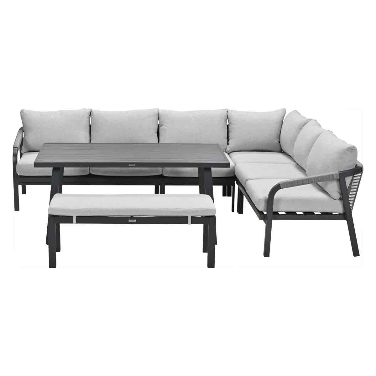 Outdoor sectional sofa with a table and bench. Light gray cushions and dark frame.