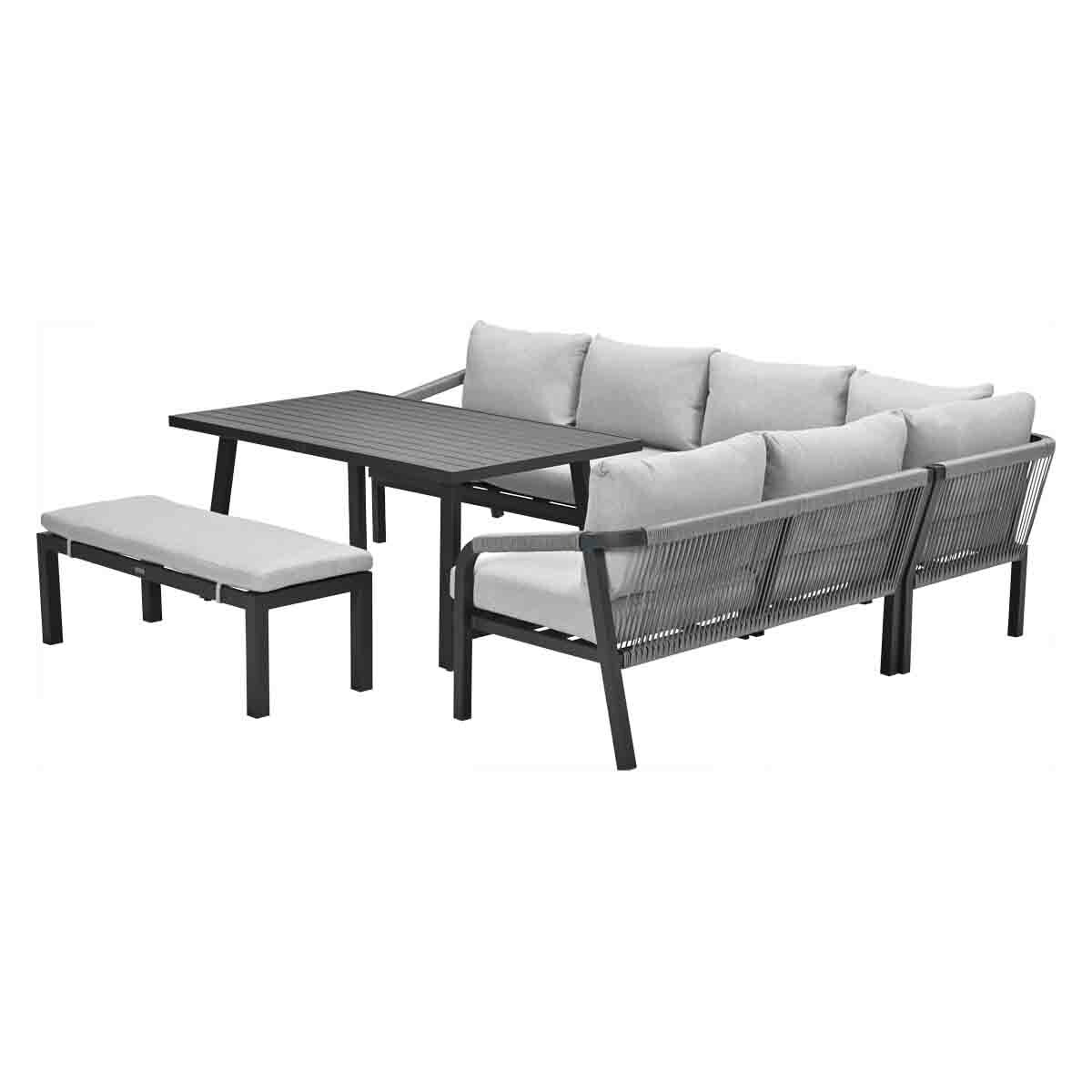 Outdoor sectional sofa with a table and bench. Gray cushions, dark frame, white background.