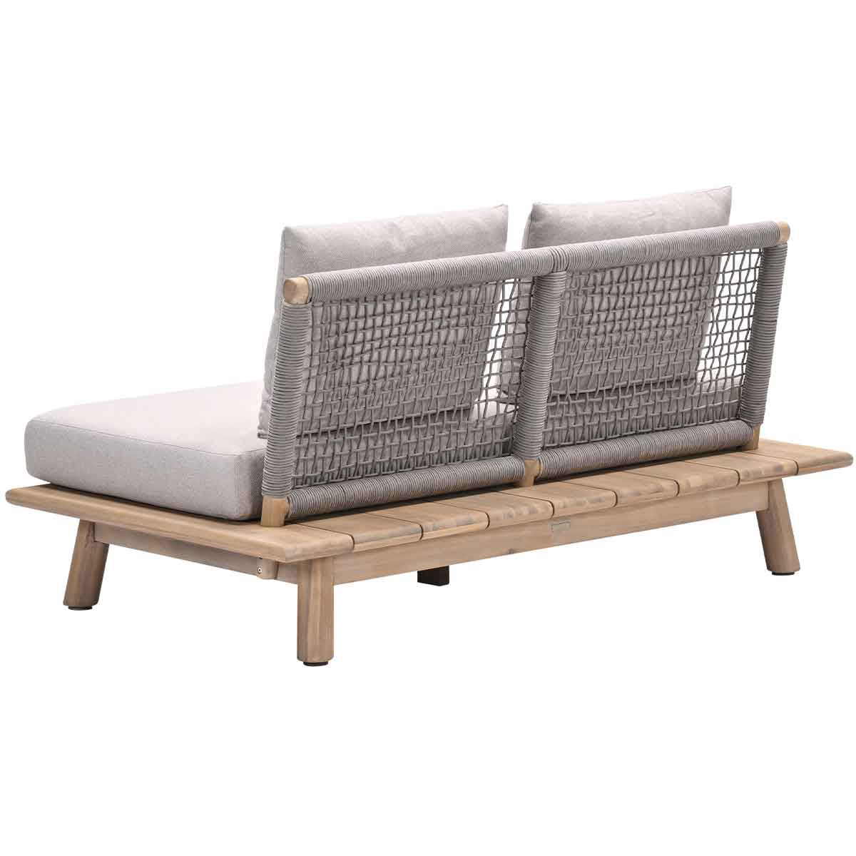Back view of a wooden outdoor sofa with two pillows and a woven back.
