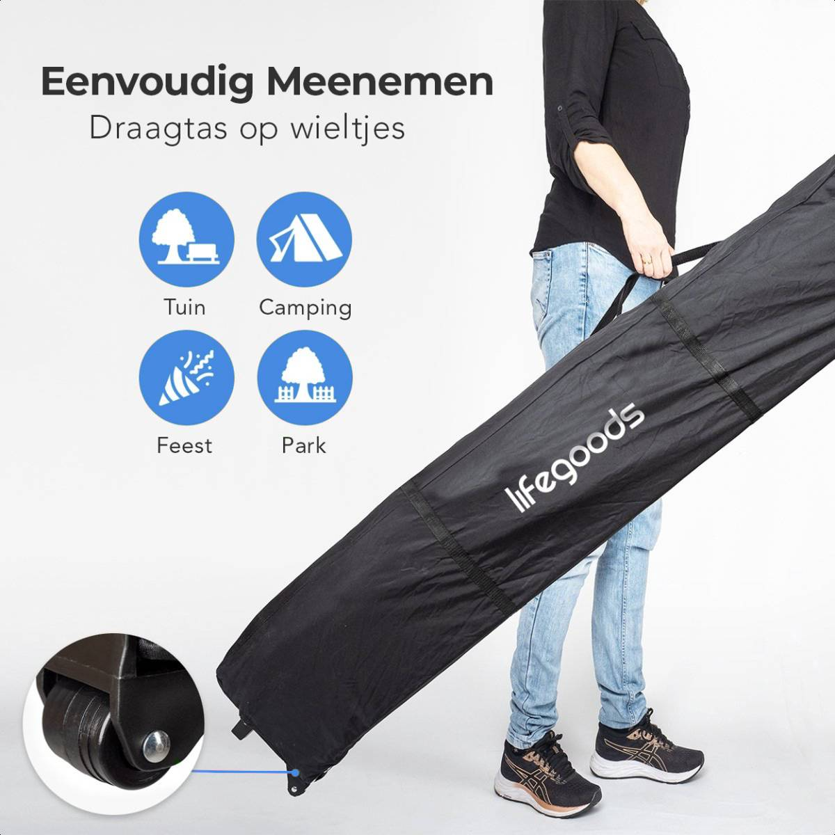 A person holds a black bag with wheels, branded 'lifegoods'.