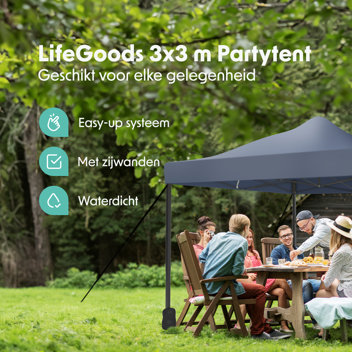 People around a table under a blue party tent in a green space. Text on the tent.