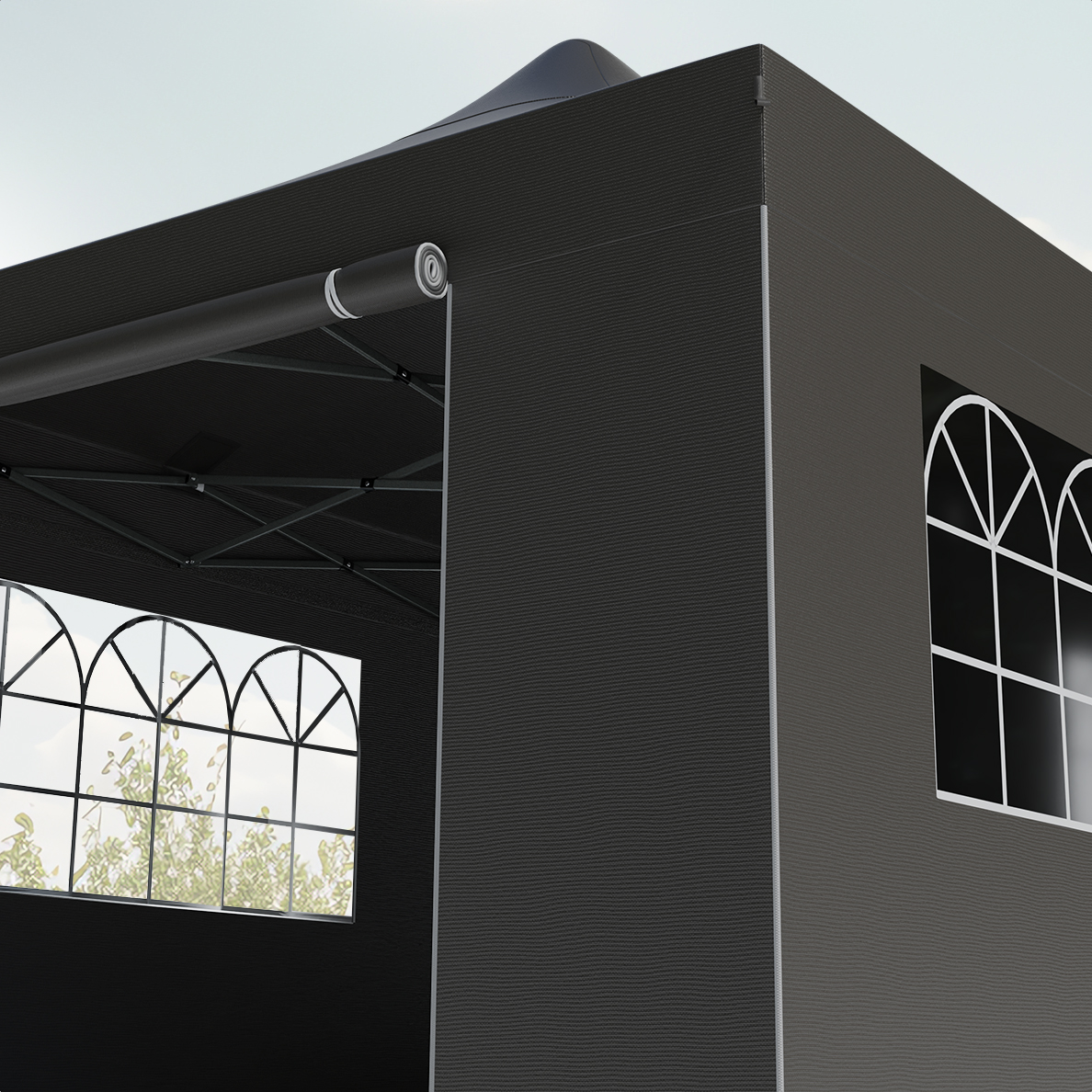 Close-up of a dark grey gazebo corner with arched windows, and a black roof, against a sky.