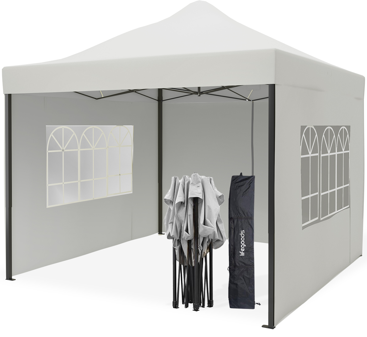 Een grijze pop-up tent met ramen, een opgevouwen tent en een draagtas, tegen een muur geplaatst.