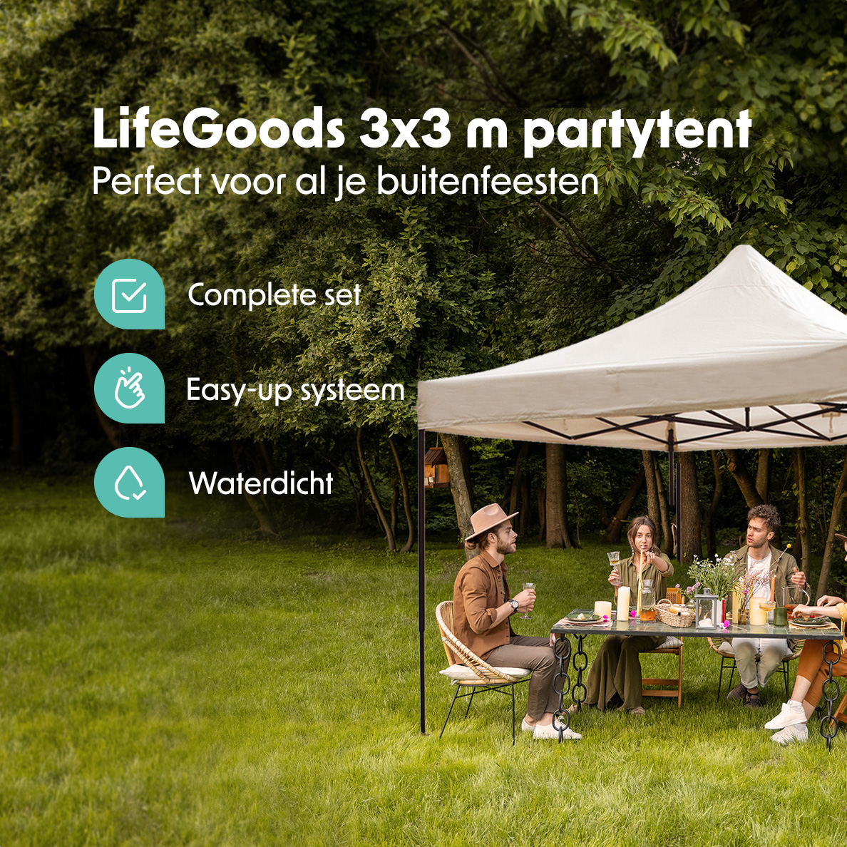 People at a table under a white party tent in a garden. Green grass and trees in the background.