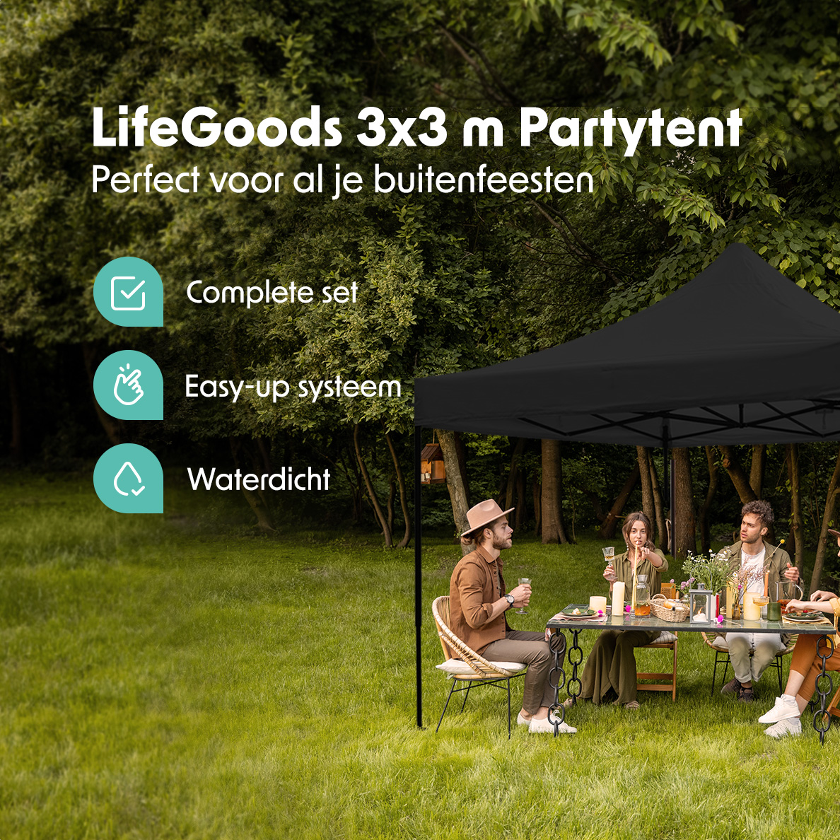 A black party tent set up in a green grassy area. People are sitting at a table.