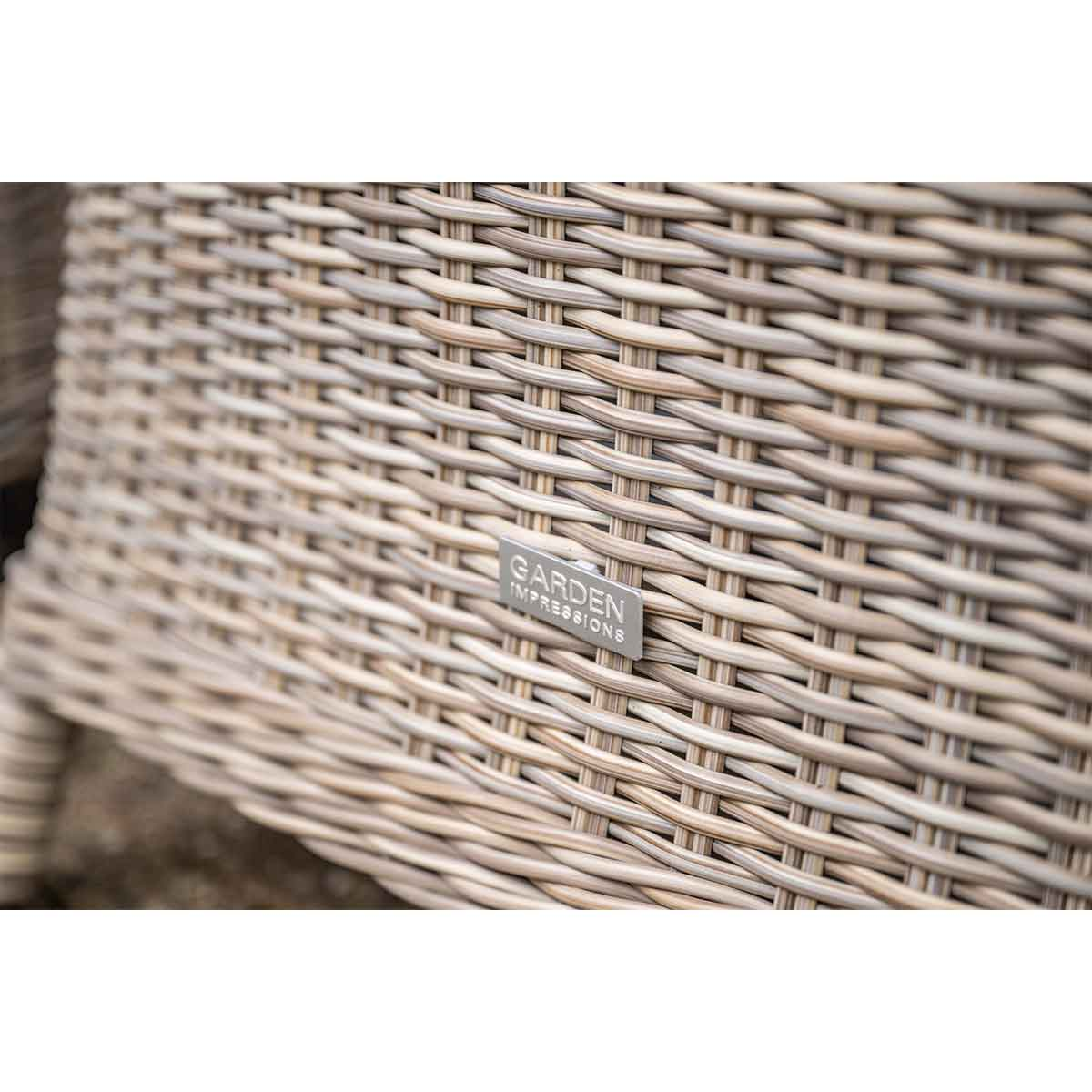 Close-up of wicker furniture. The brand Garden Impressions is visible.