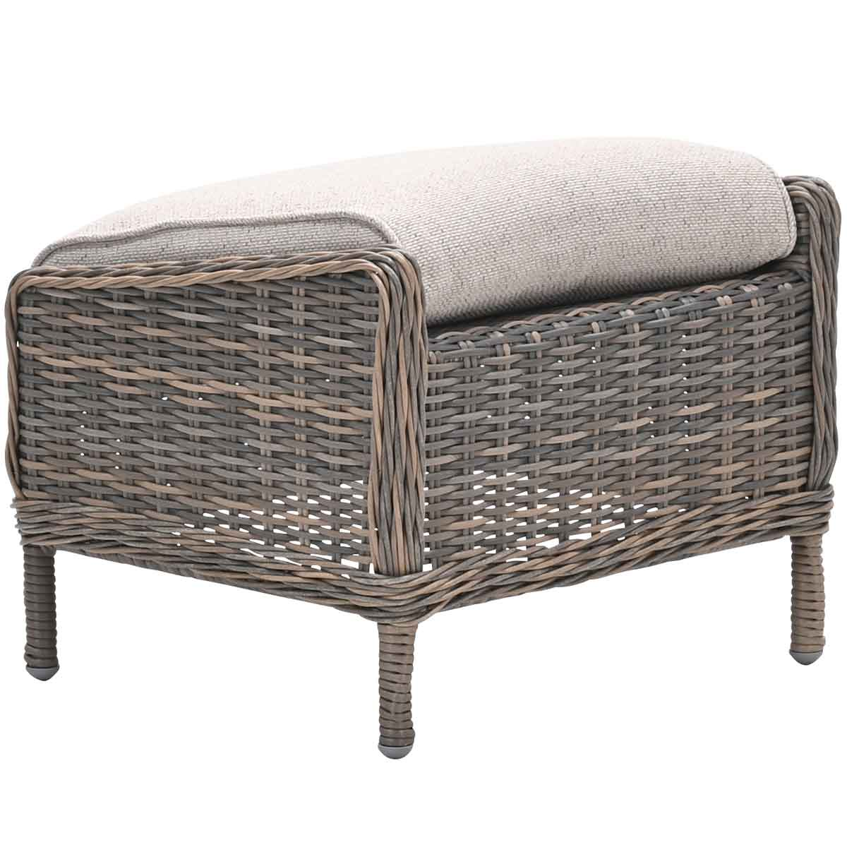 Wicker footstool with cushioned top. Gray wicker frame, beige cushion.