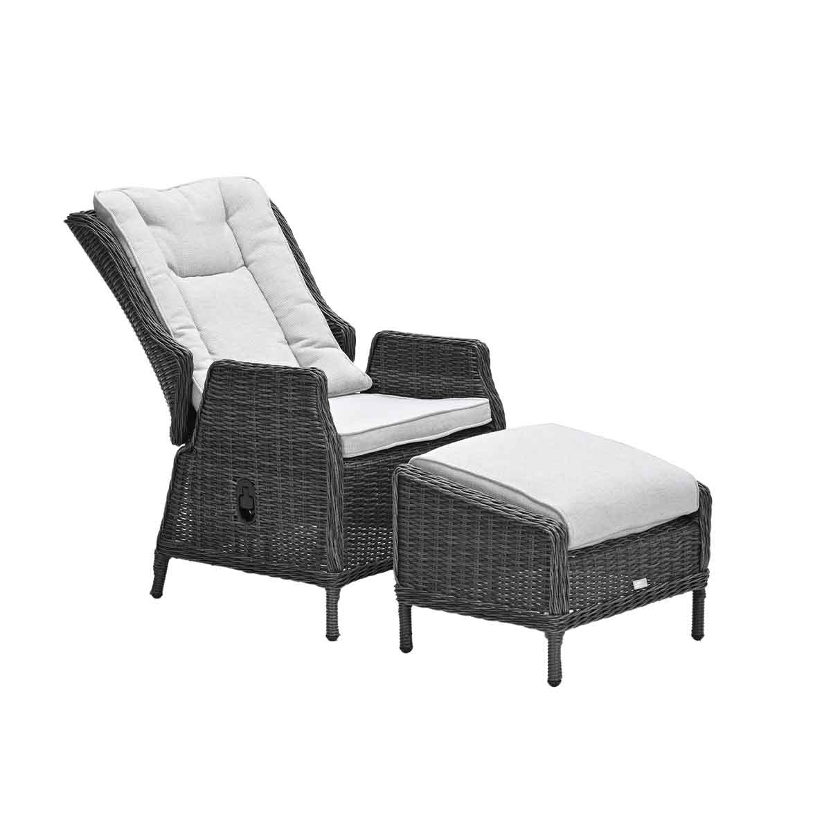 Rattan chair with footrest, gray cushions. Dark gray rattan. White background.