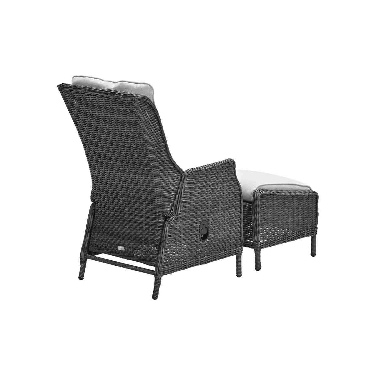 Wicker recliner with ottoman, gray cushions, on white background.